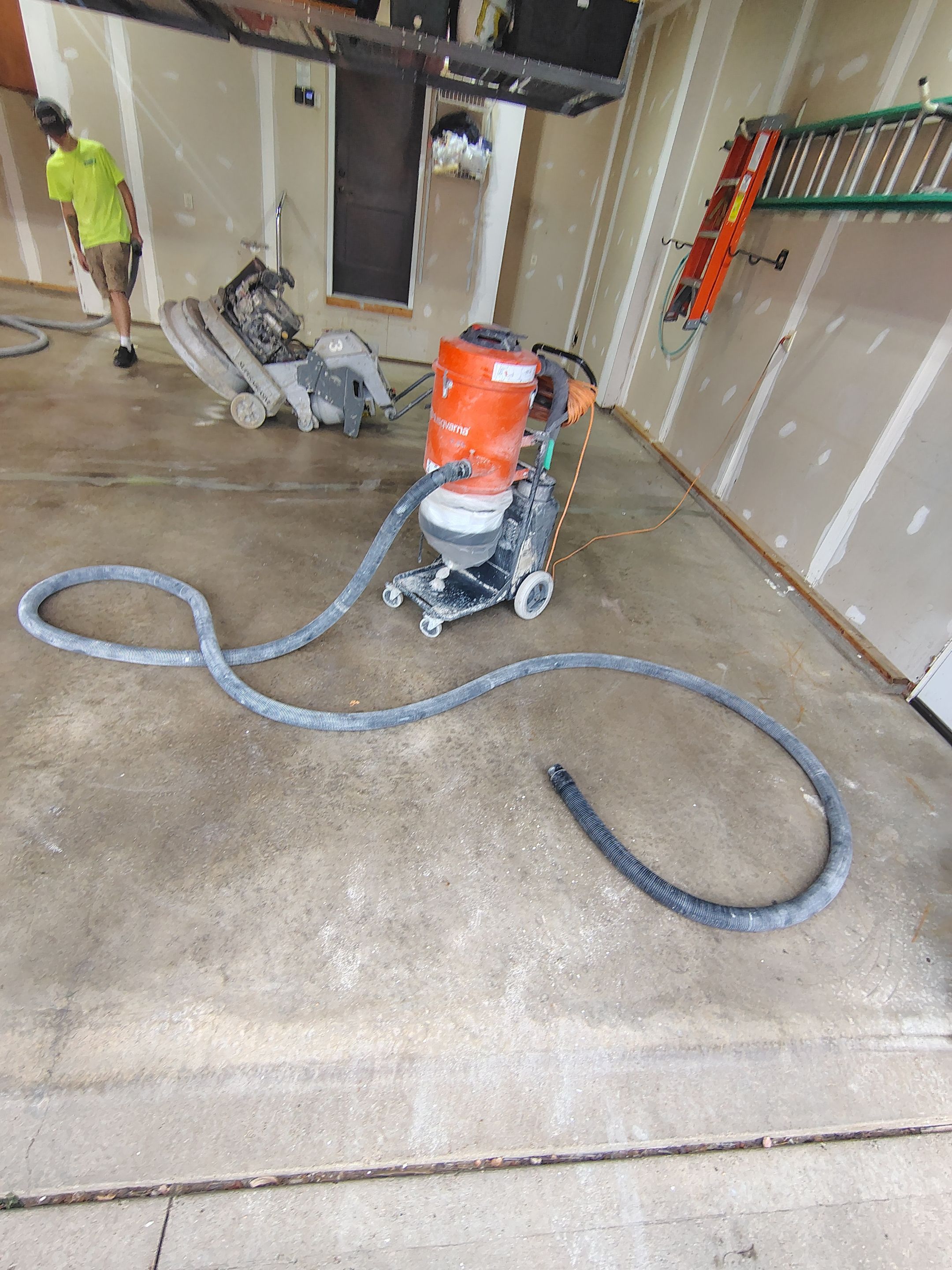 Sioux Falls Garage Concrete Grinding and Nightfall Decorative Chip Coating by Select Painting, Coatings & Garage Cabinets