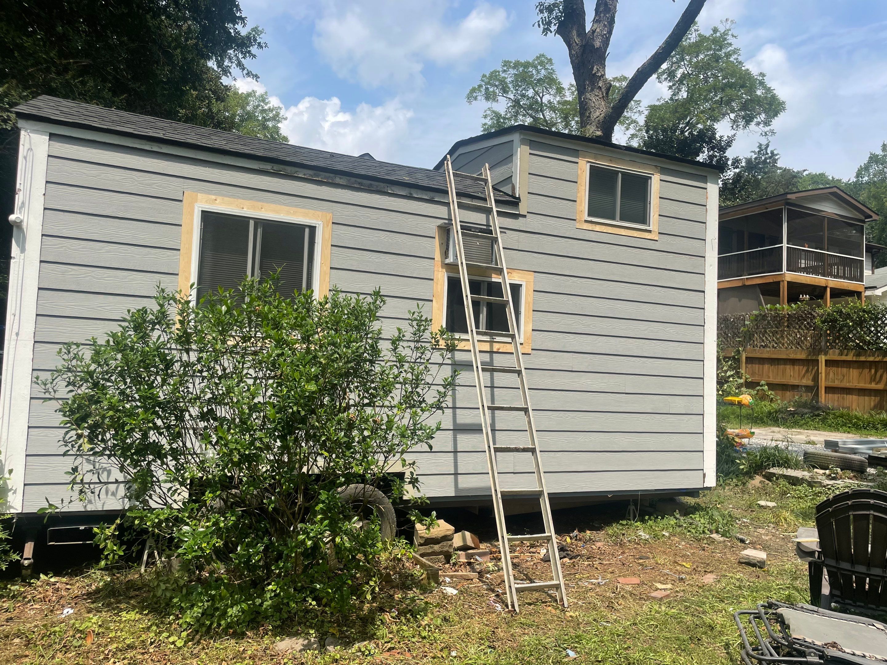 tiny home remodel- siding,paint,roofing by Nailed It Roofing & Remodeling LLC