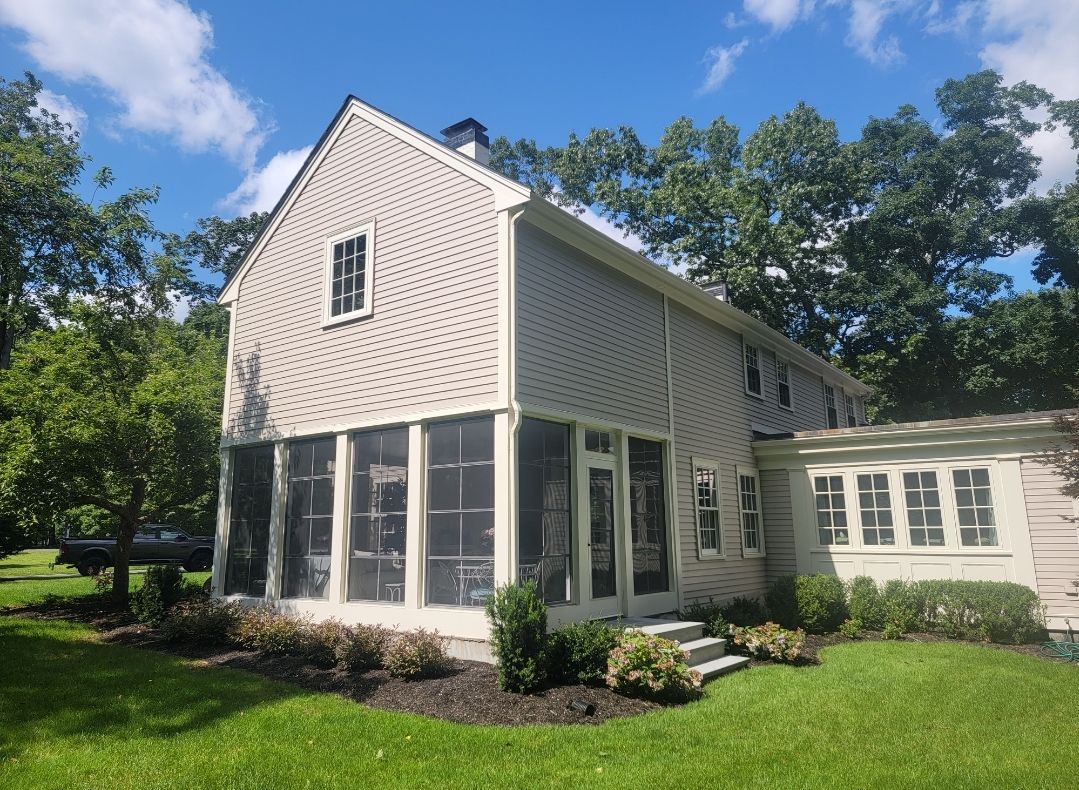 Wood Clapboards and vinyl Slate roof with new Pella windows in Wellesley. by UBrothers Construction