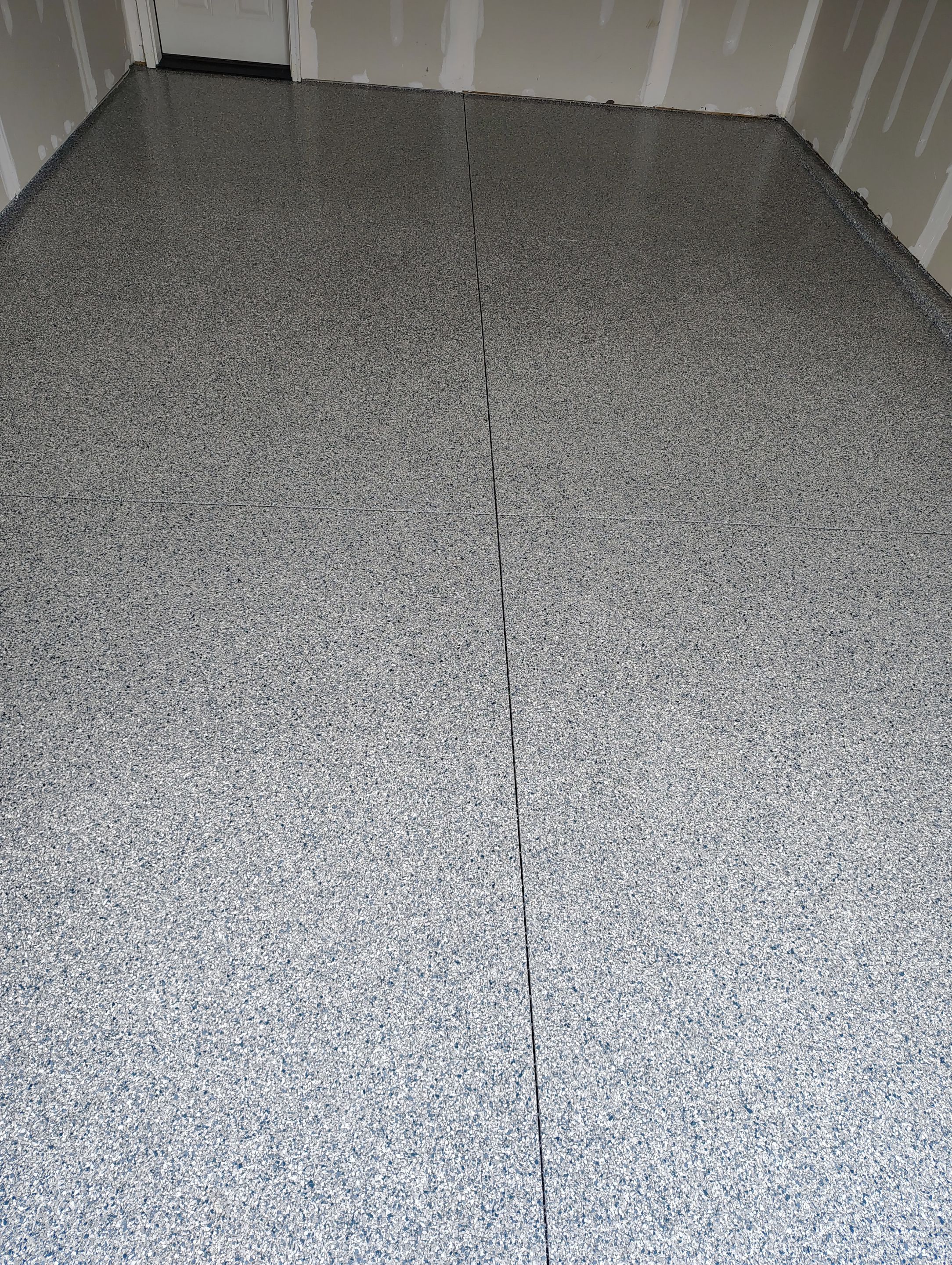 Custom Epoxy Garage Floor Coating Installation in Sioux Falls by Select Painting, Coatings & Garage Cabinets