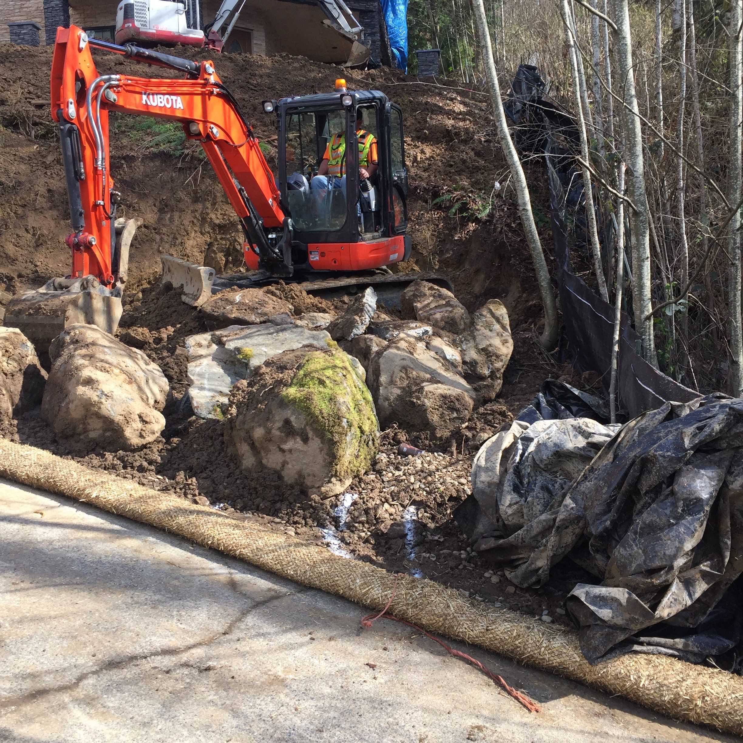 Asphalt Driveway and Stamped Concrete Patio Finish  by Jireh Asphalt & Concrete Inc 