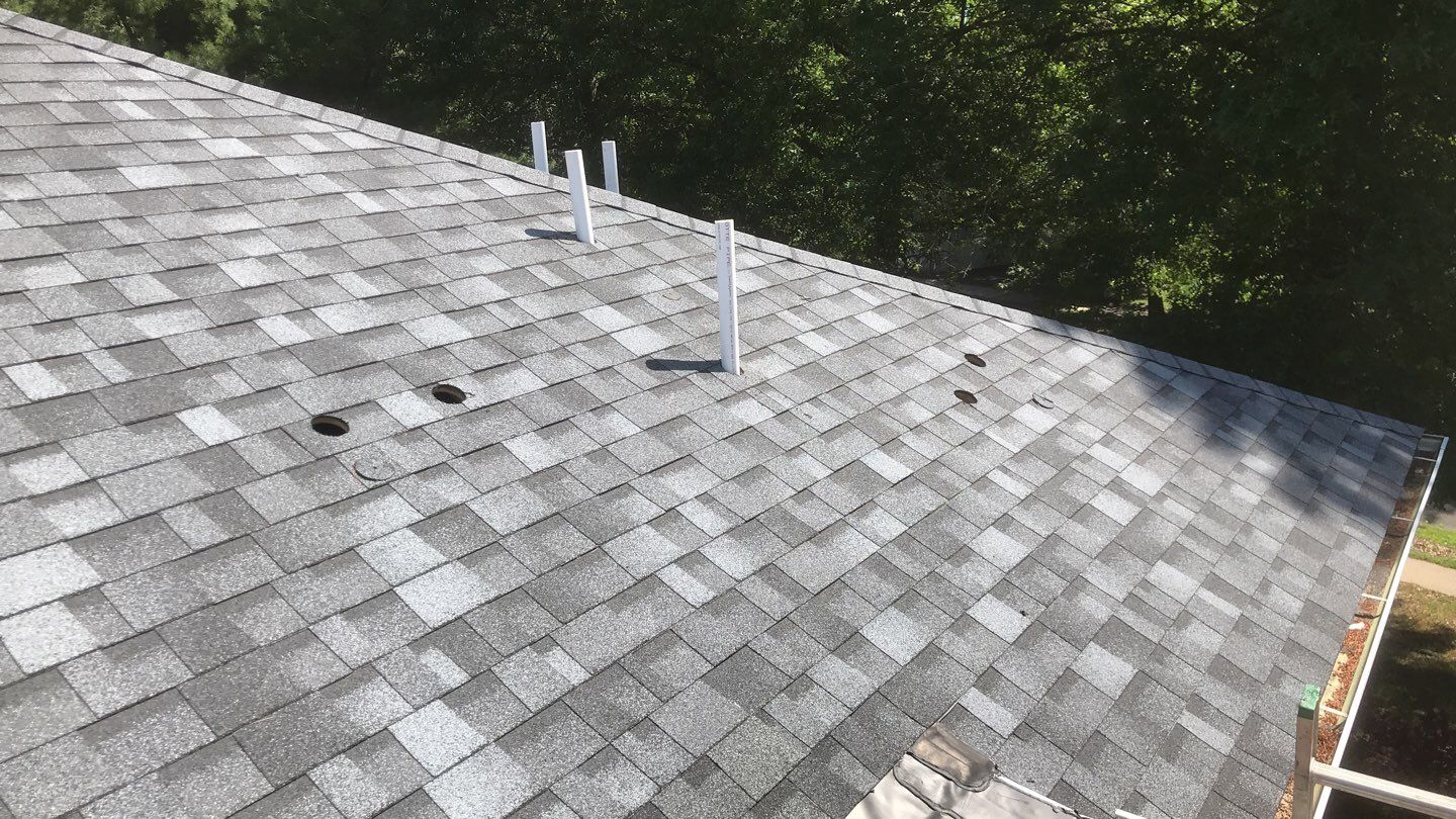 Commercial Roofing Installation using EPDM with white gutters by A Plus Exterior