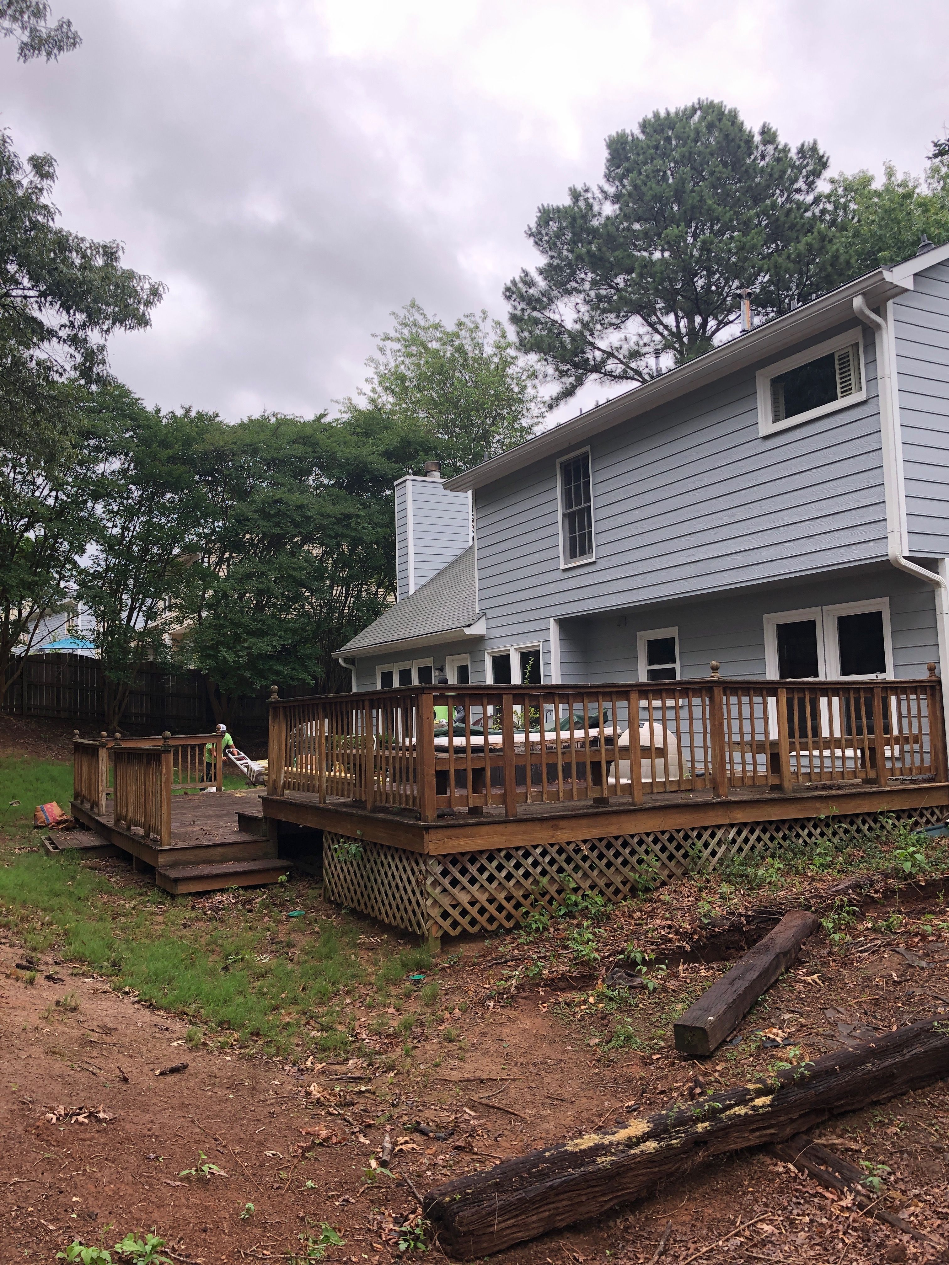 Composite Deck Replacement with White Railings in Duluth by Swift Home Renovations