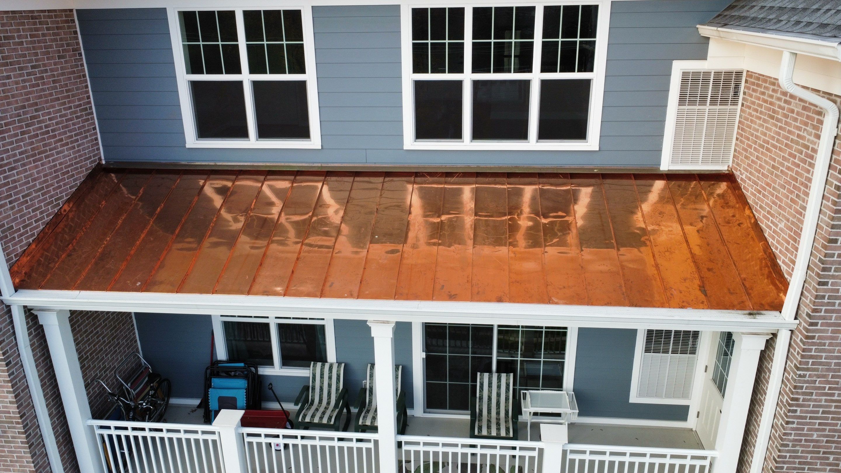 Standing Seam Metal Roof using Copper by CMNG LLC