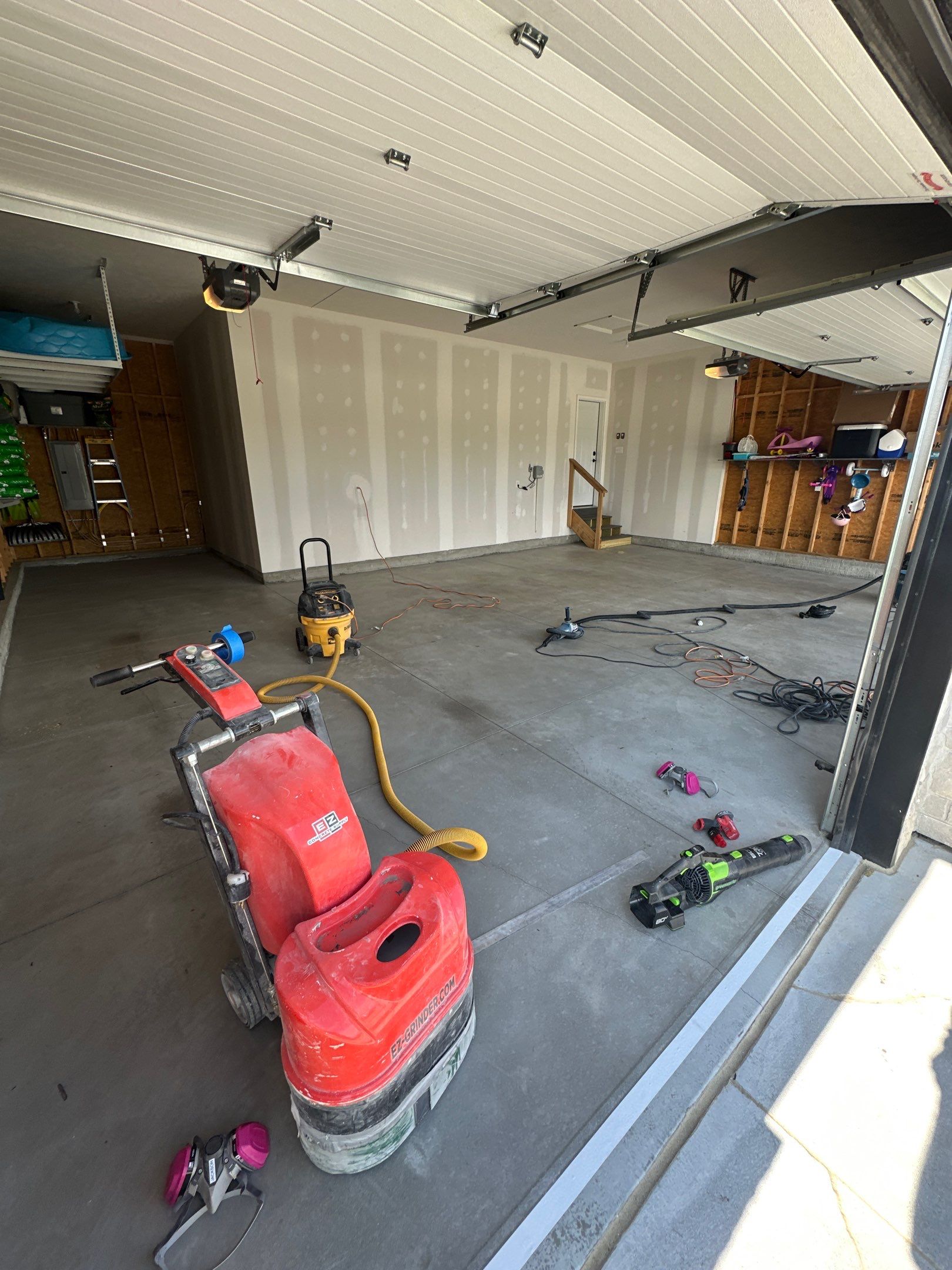 Three-Stall Garage Epoxy Floor Coating Installation in Lincoln by Goat Coatings