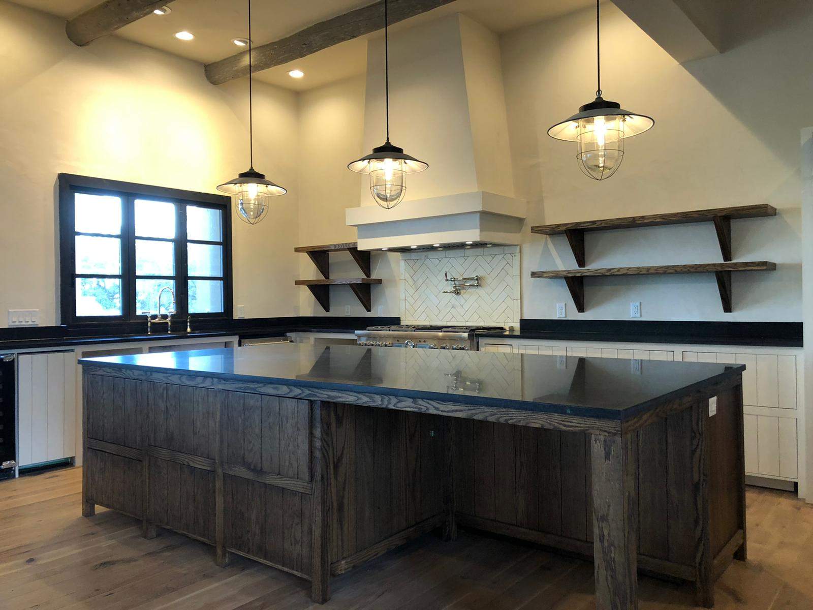 Kitchen, outdoor kitchen and pool brick floor installation by Mena stone surfaces
