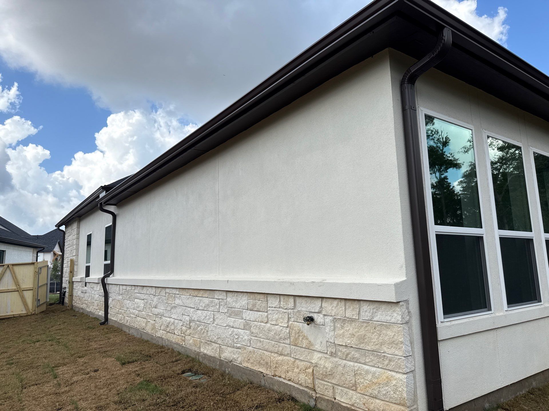 Magnolia Craftsmanship: Stucco and Foam Accents with Stone Integration by Apex Conventional Stucco Llc