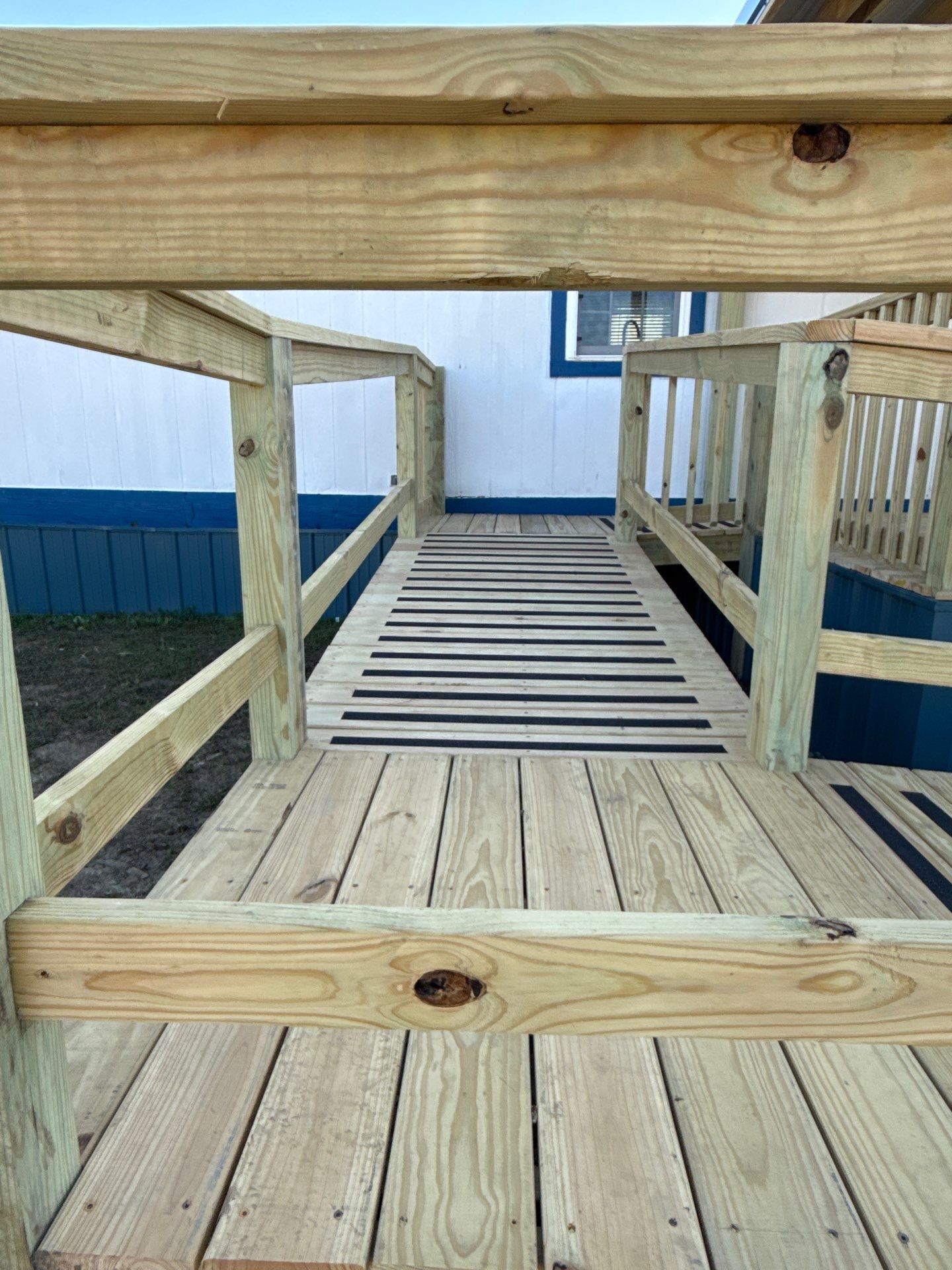 Covered Deck w/ ADA Ramp by In & Out Construction & Remodeling, LLC