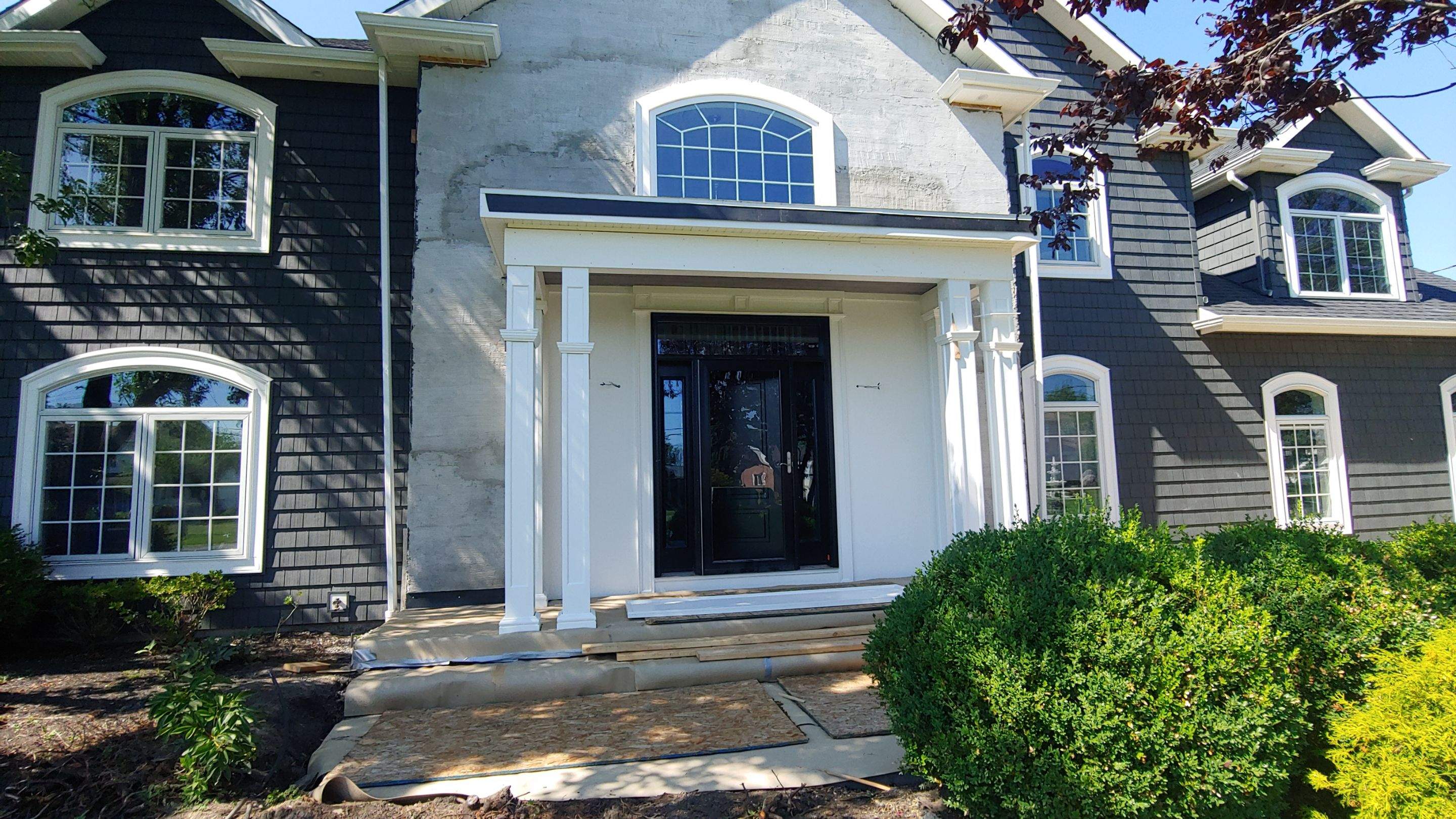 Exterior Renovations- Siding, Concrete, Railings, and Entry Door  by Ivy Lea Construction
