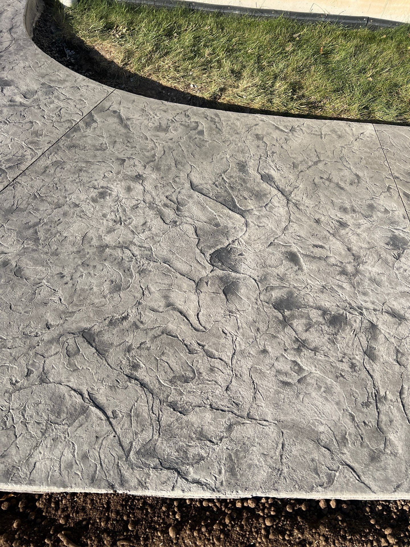 Oxford Slate stamped concrete patio  by NG Masonry & Construction LLC