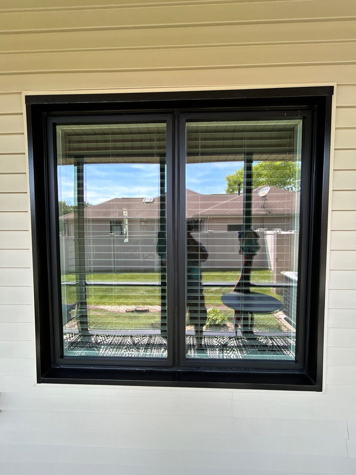 Black Vinyl Window Installation by Merrifield Exteriors, LLC