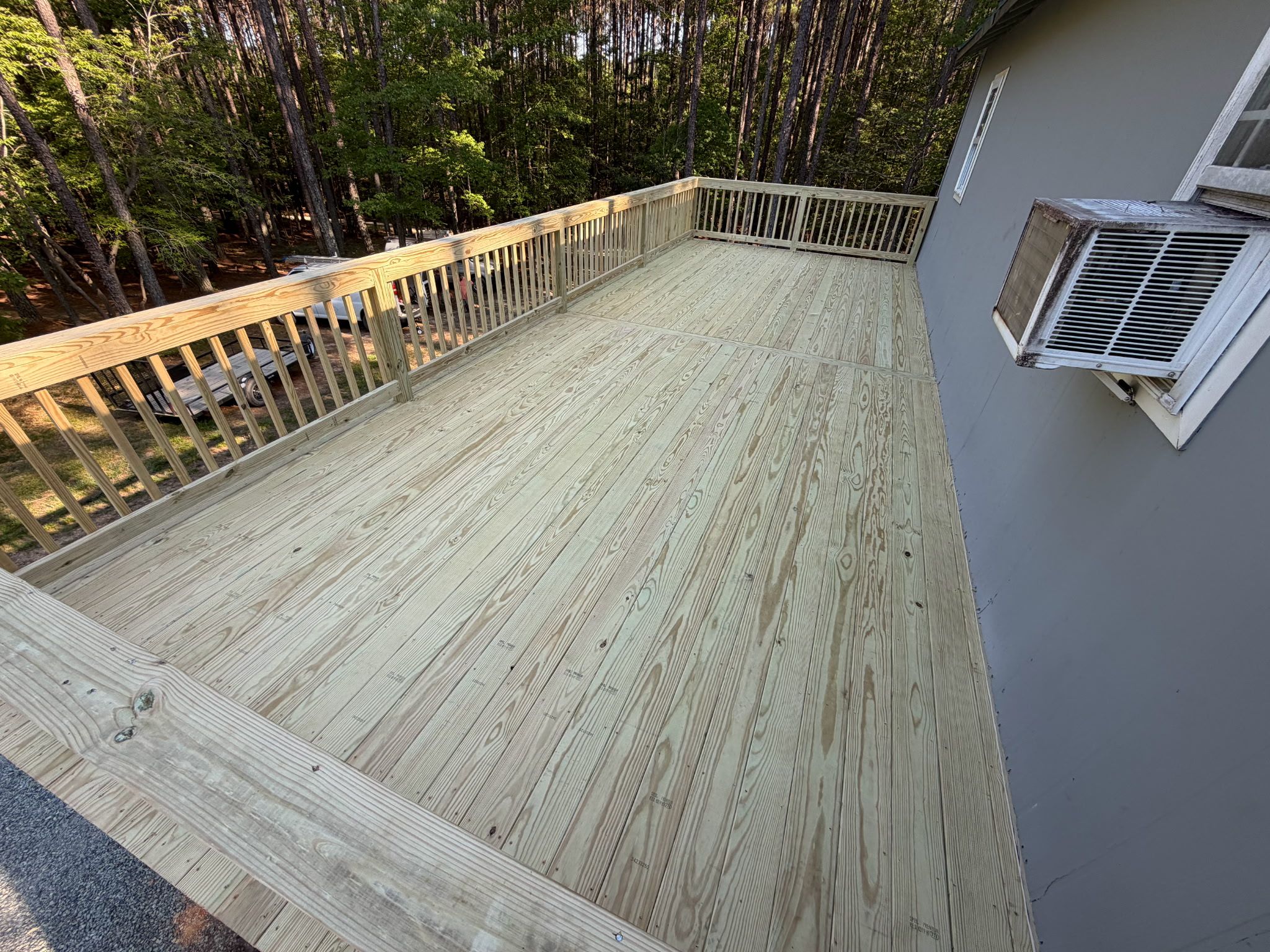 Pittsboro Outdoor Living Transformation – Retaining Wall, Paver Patio & Elevated Deck by Elite Remodeling and Design LLC