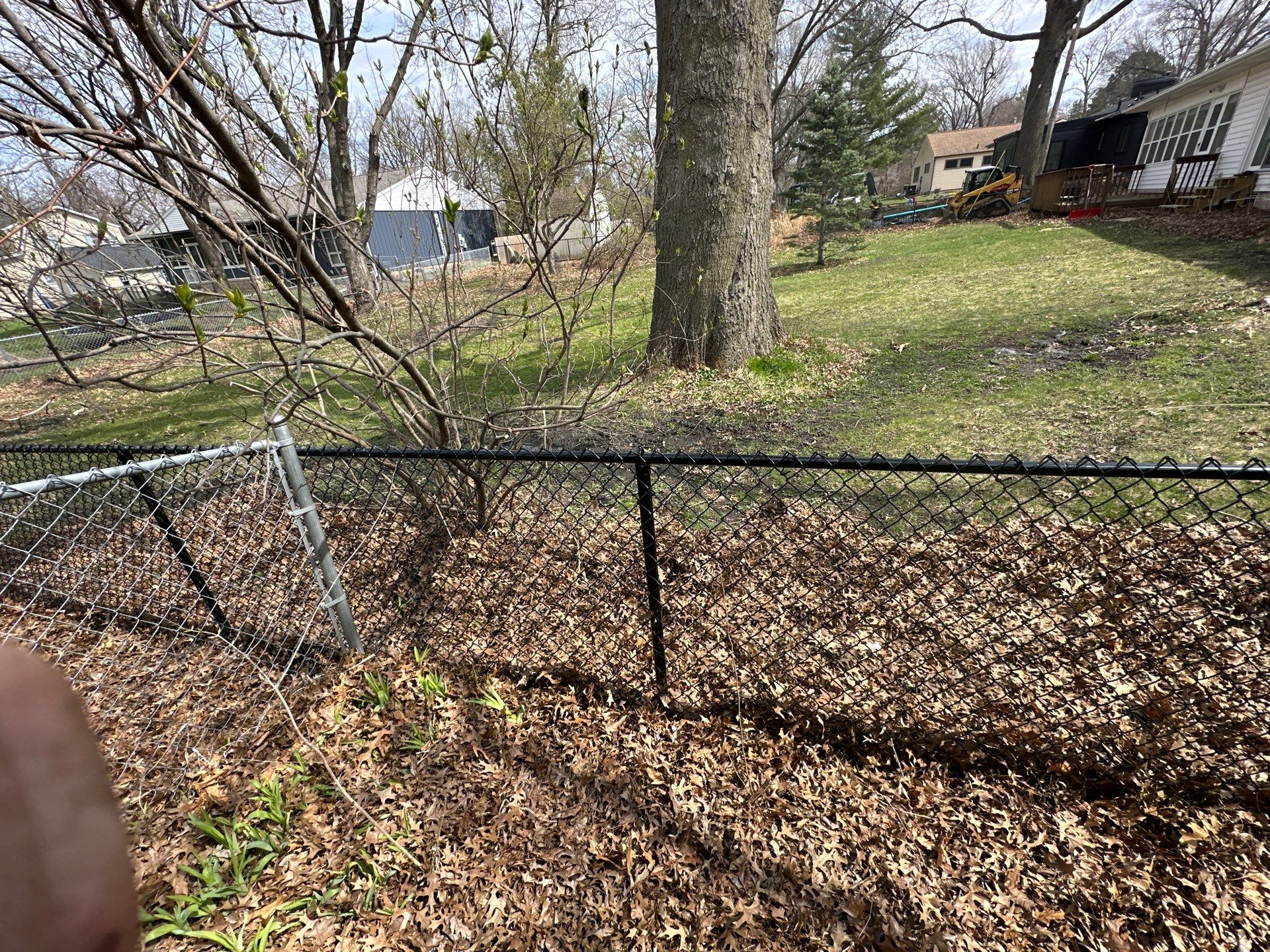 Black Vinyl-Coated Chain Link Fence Installation in Cedar Falls by Perfect Picket Fence and Stain