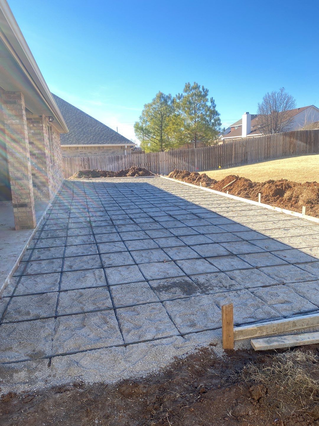 Concrete Slab , Retaining Wall , Fence, and landscape. by Clays Services Inc