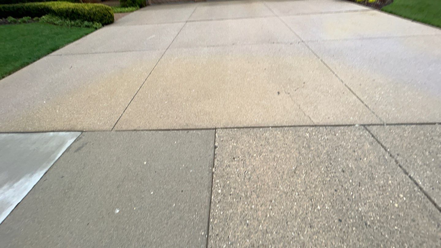 concrete patio and driveway cleaning by Northern Power Washing LLC.