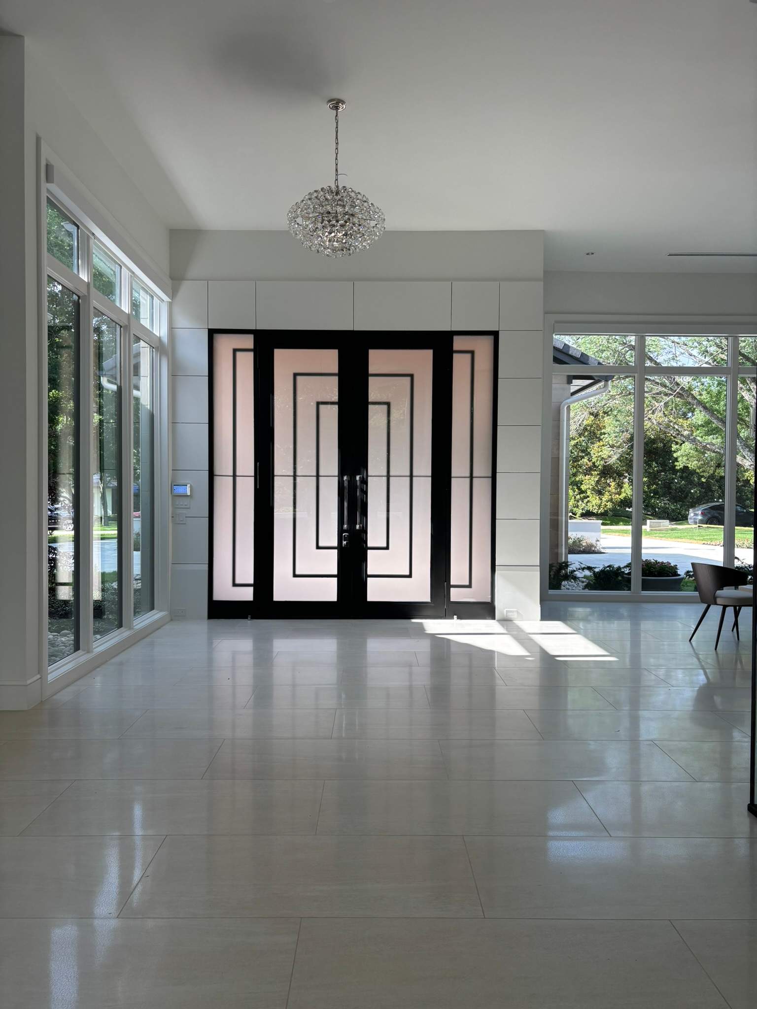 Modern Metal and Glass Entryway Installation with Custom Hardware Finishing in Dallas by Solara Custom Living