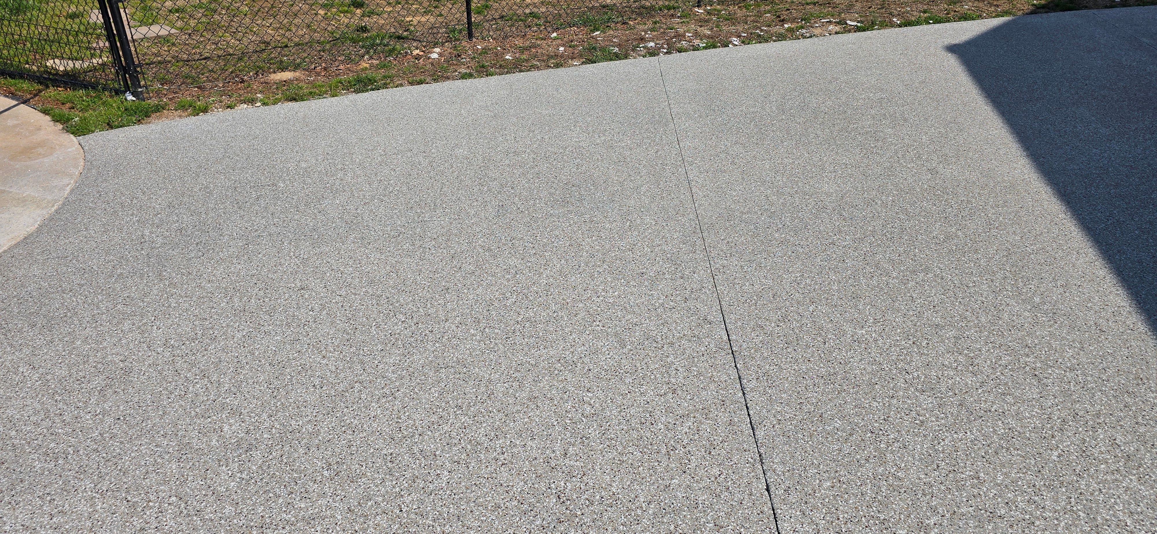 Driveway using Creekbed by Elite Floor Solutions