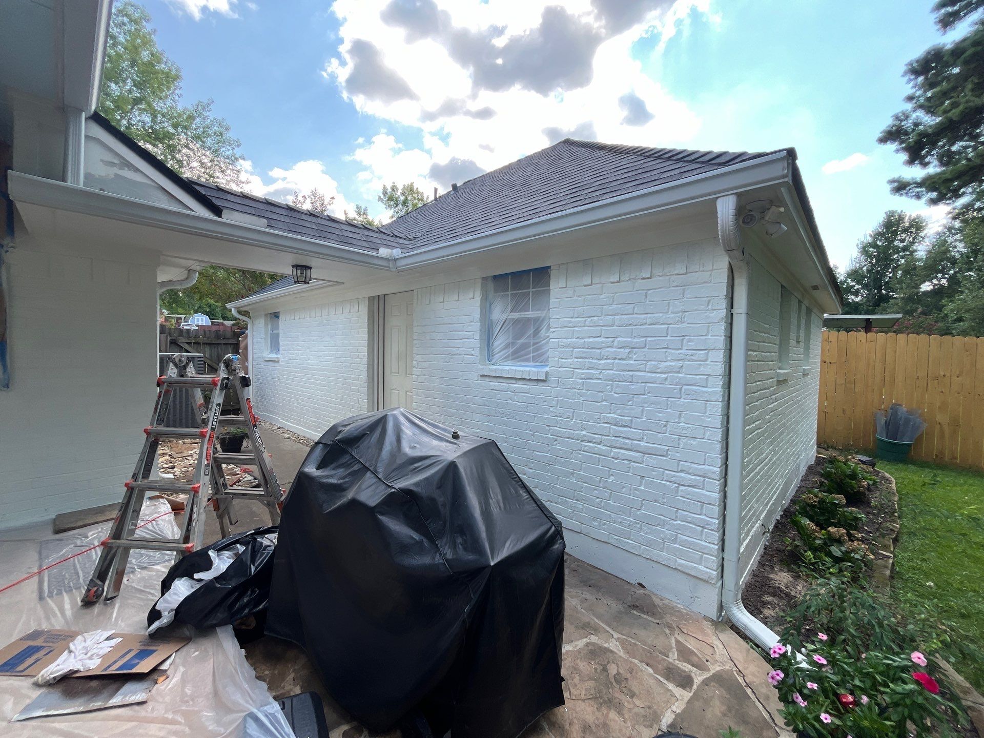Exterior Painting in Tyler, TX | Brick House with White & Blue Finish by Quality Coats Painting