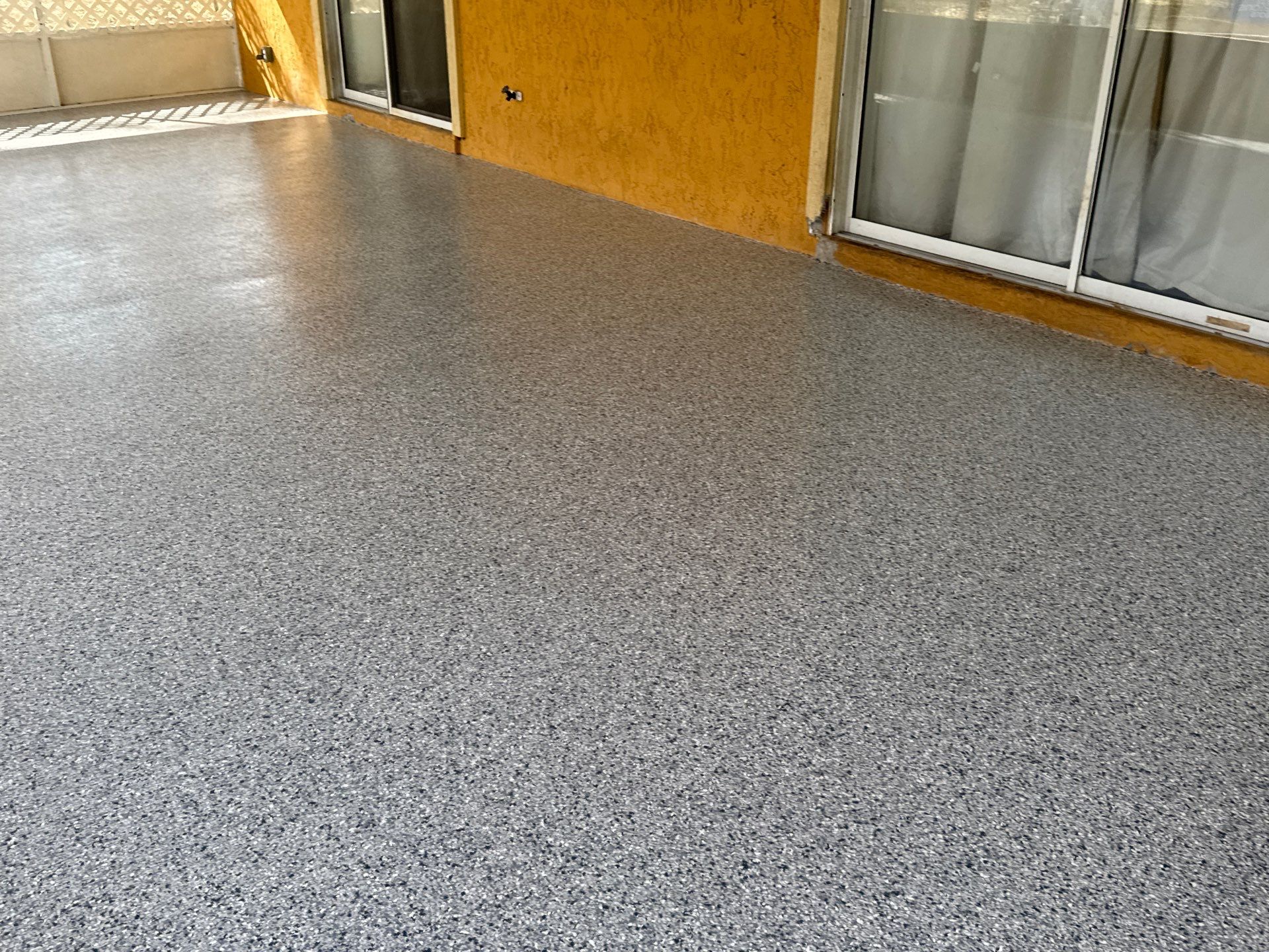 Patio in Tidal Wave by Cross Creek Concrete Coatings