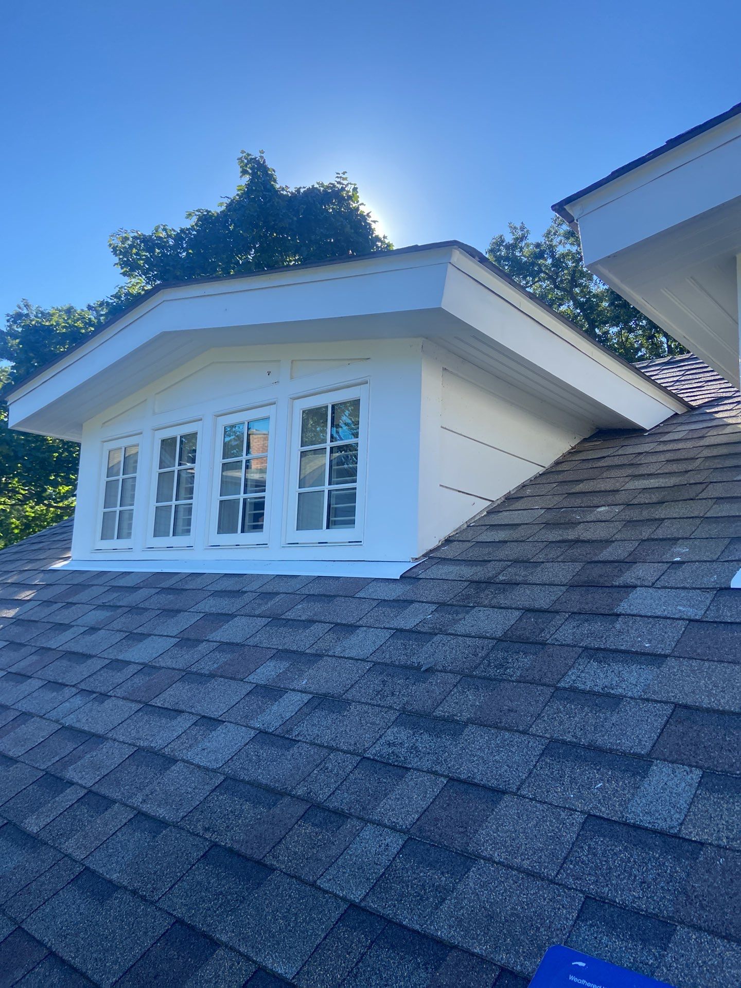 Asphalt Roof Replacement with Half Round Copper Gutter Installment by Custom Installations