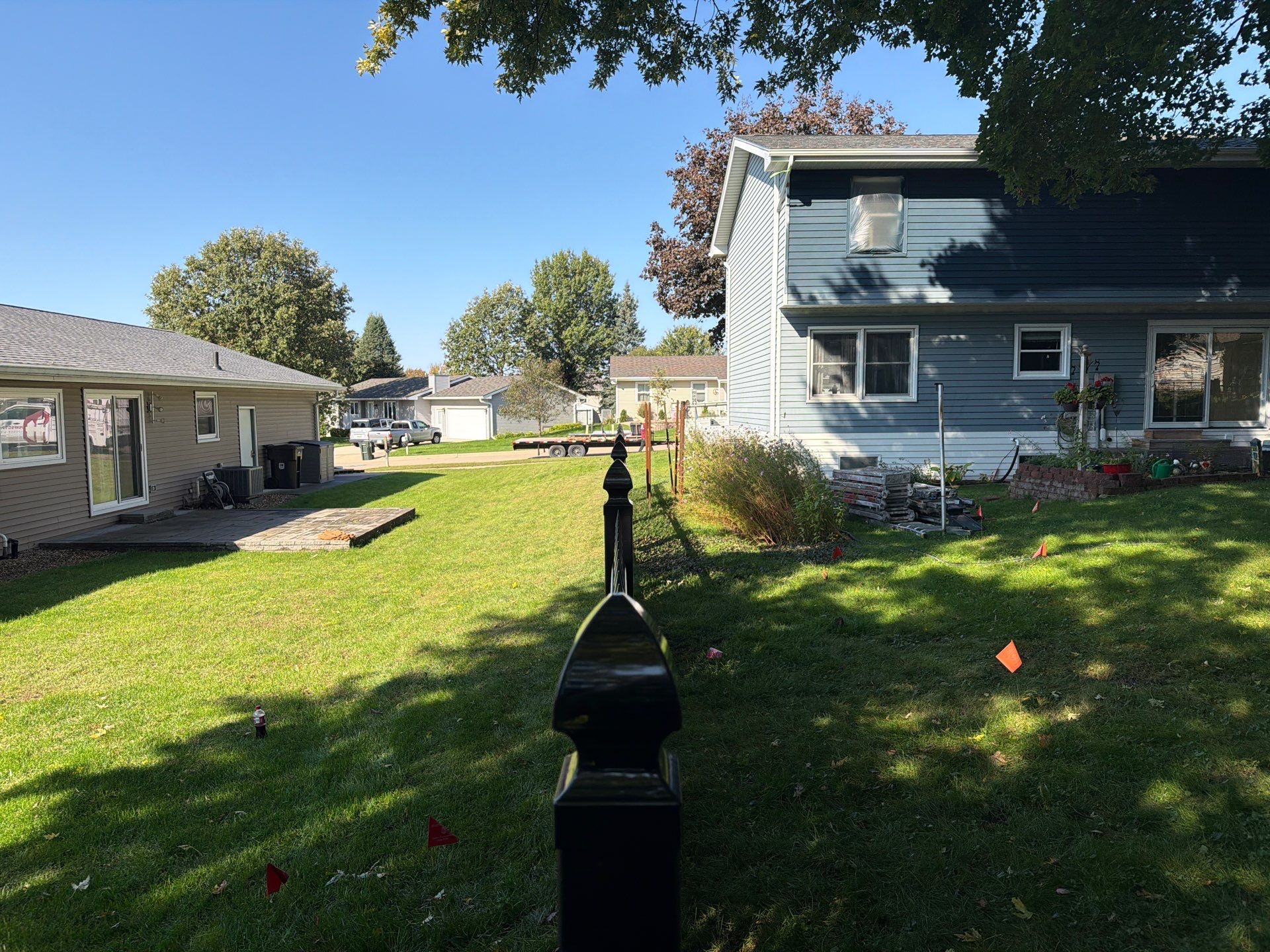 Black Vinyl Spaced Picket Fence Installation in Cedar Falls by Perfect Picket Fence and Stain