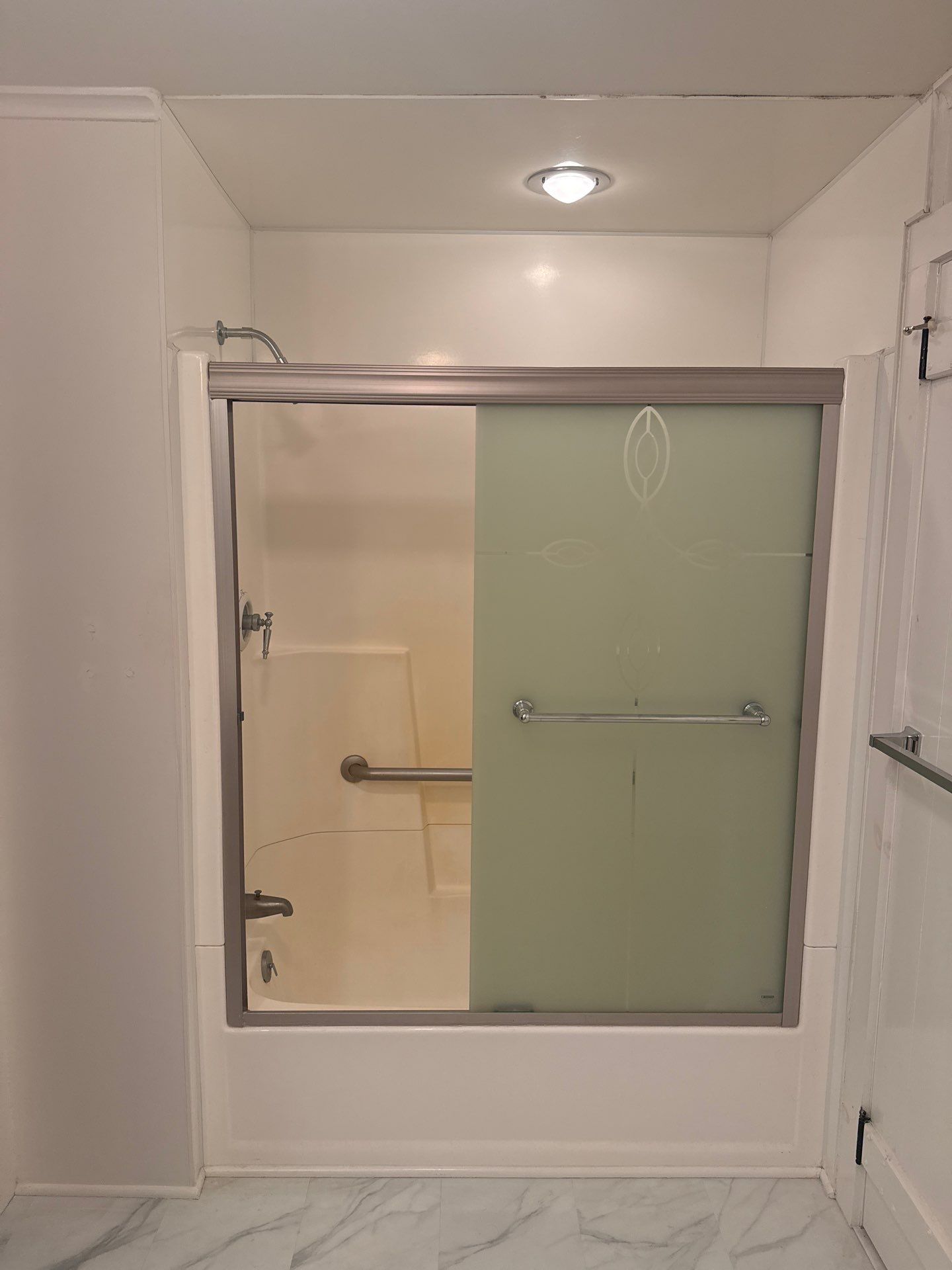 White Subway Tile Walk-In Shower Replacement in Boyne City by Rainbow Seamless Systems