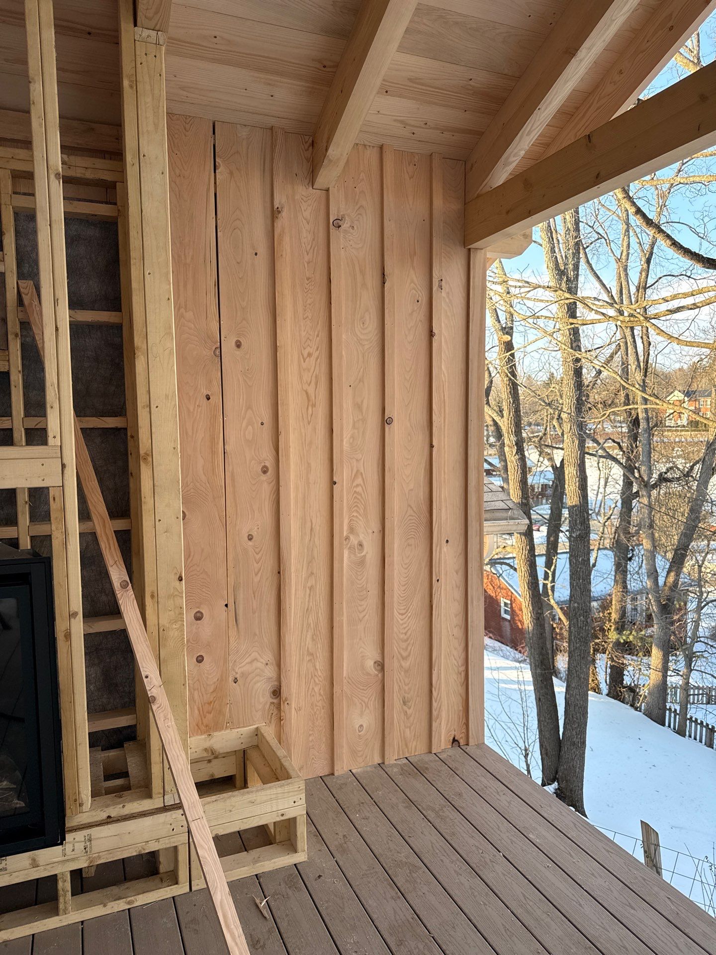 Custom Composite Deck with Stone Fireplace and Modern Cable Railing by Walnut Hollow Decks & Outdoor Living