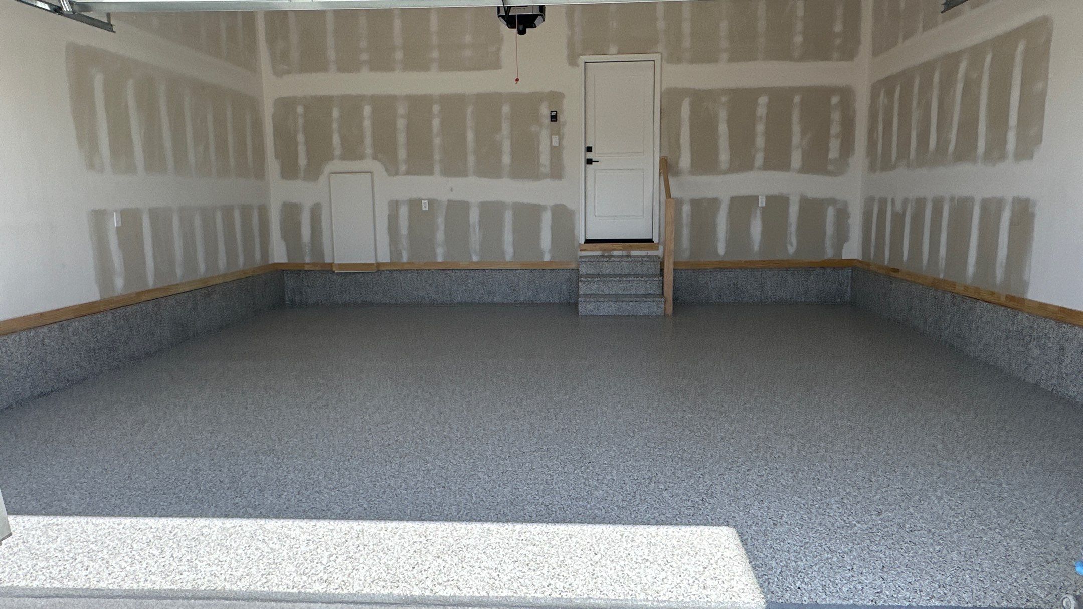 Phil B. new floor with Coyote flake by Banner Garage