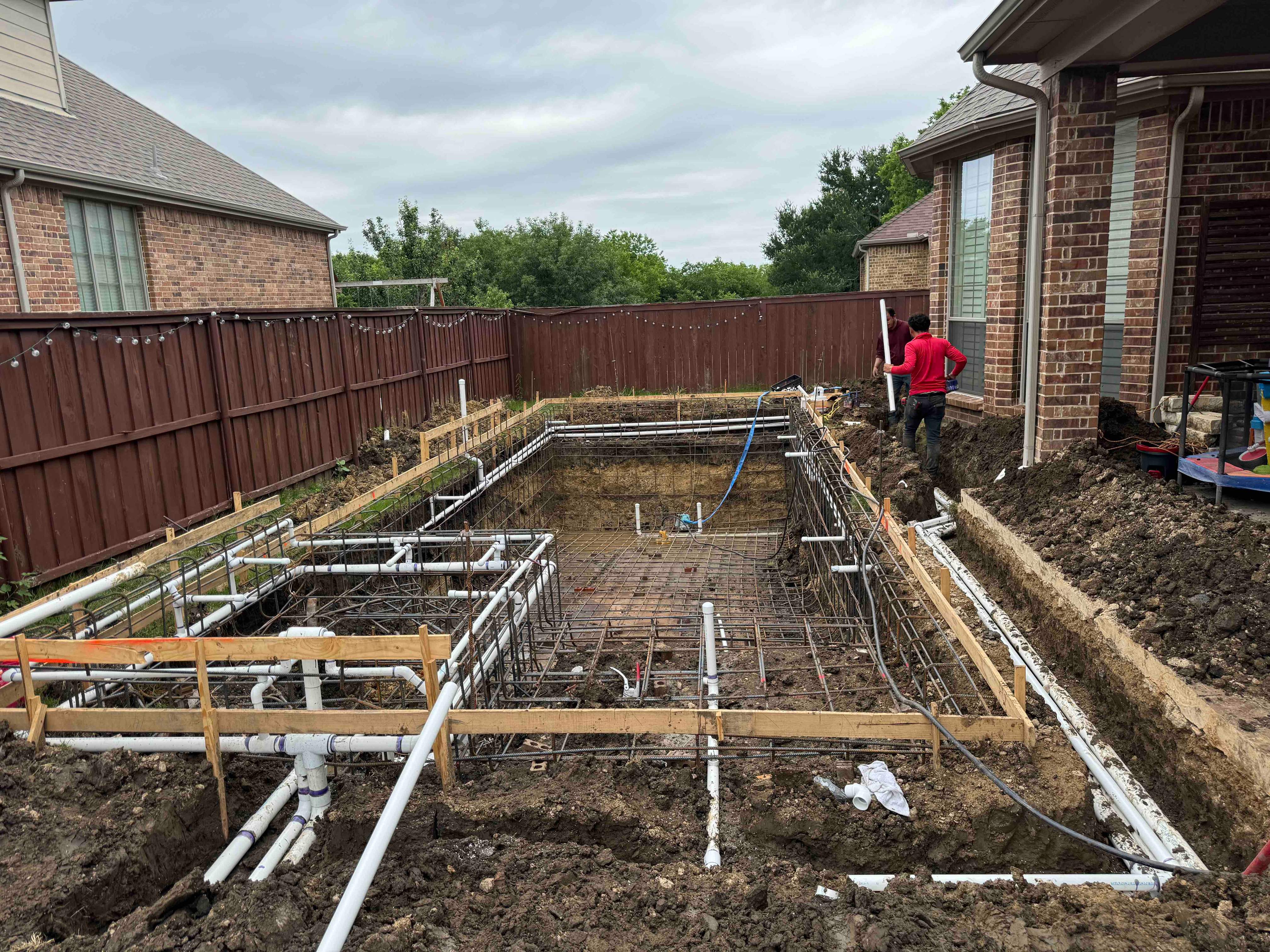 Freeform Pool with Raised Spa and Rock Waterfall by Pinnacle Pools and Spas - DFW