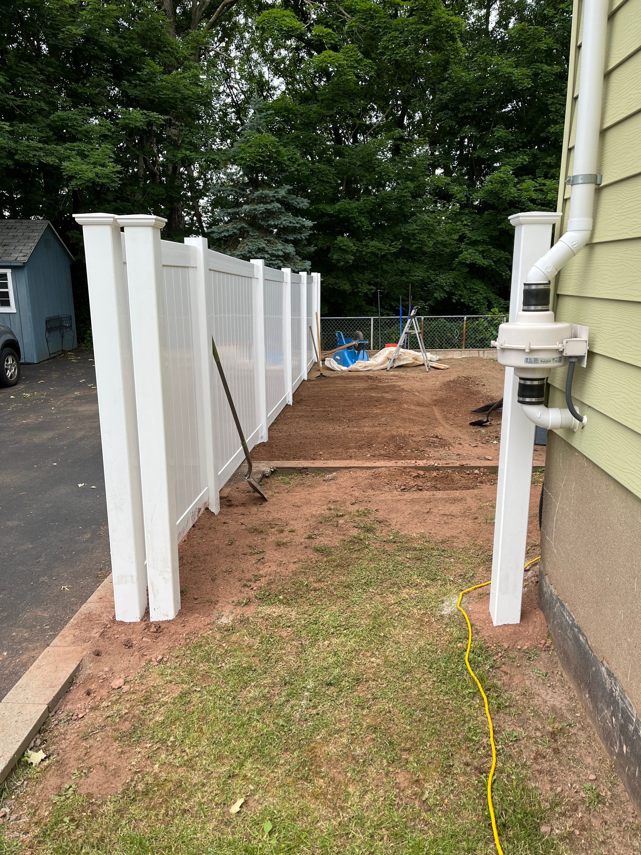 New Vinyl Privacy Fence with matching gate in White by DiGiorgi Roofing and Siding Inc