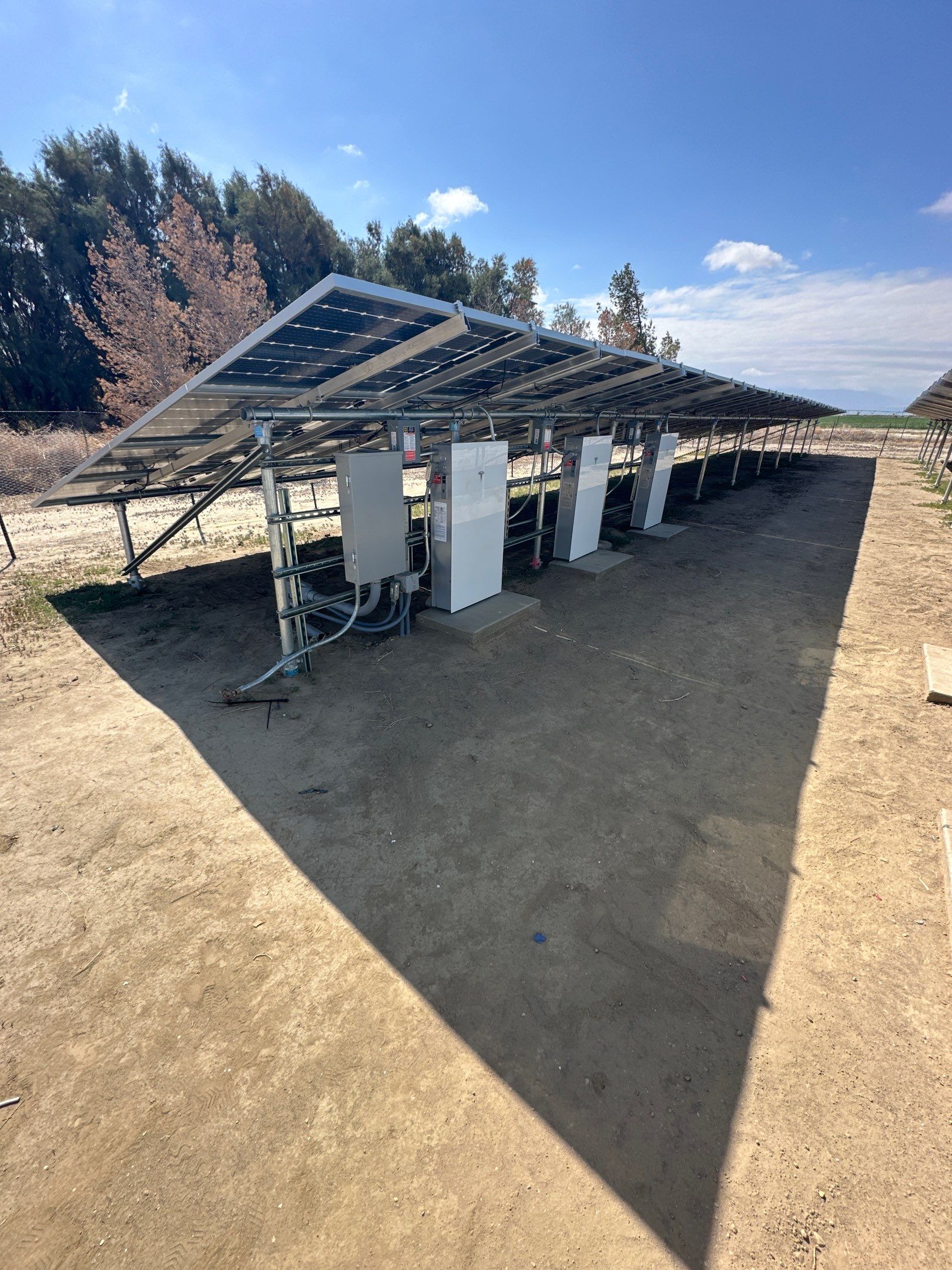 Large-Scale Ground-Mount Solar and Tesla Powerwall Battery Installation by AWS Solar