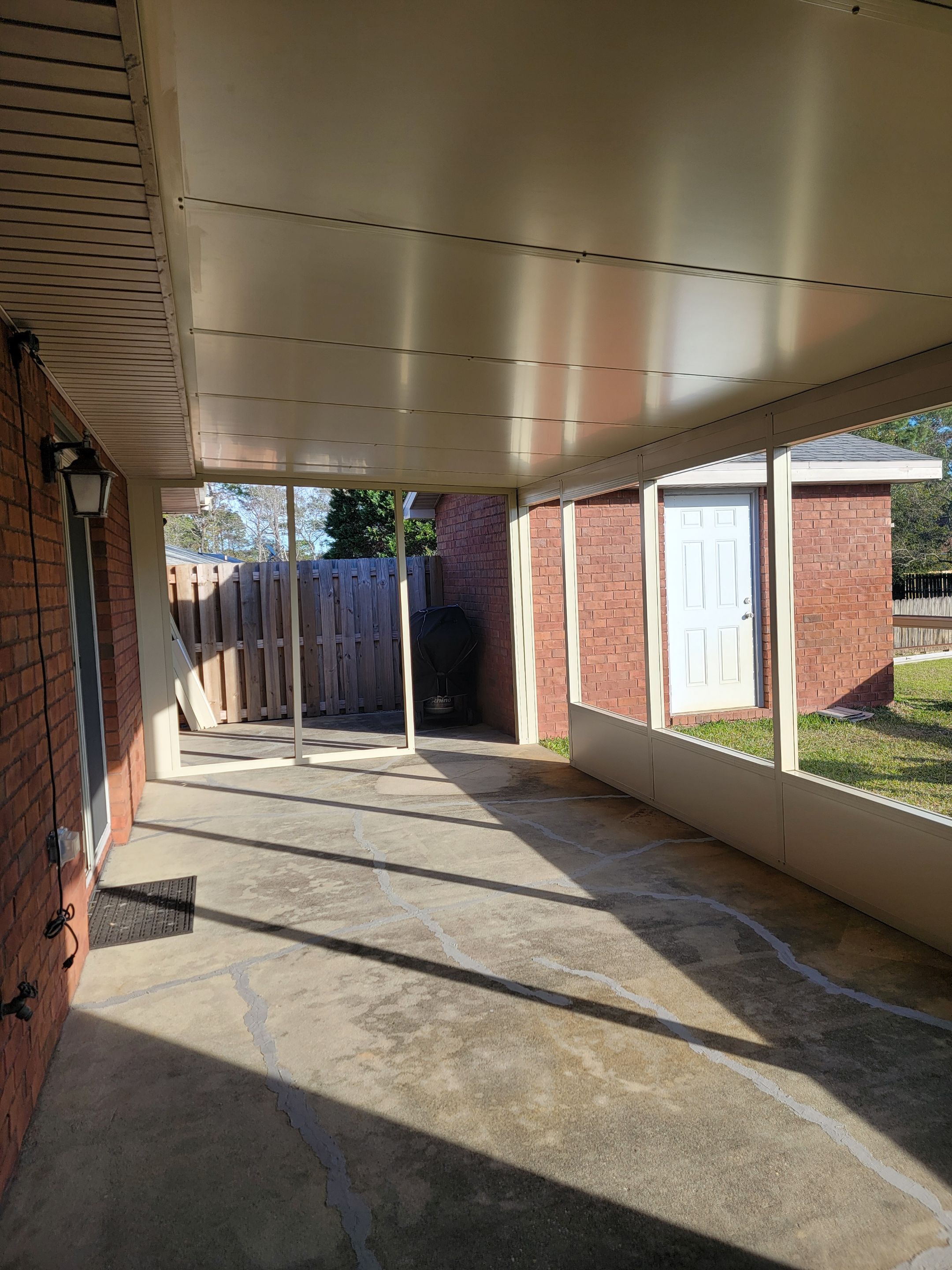Enclosure w/Vinyl Windows using Colorbeam by Titan Sunrooms