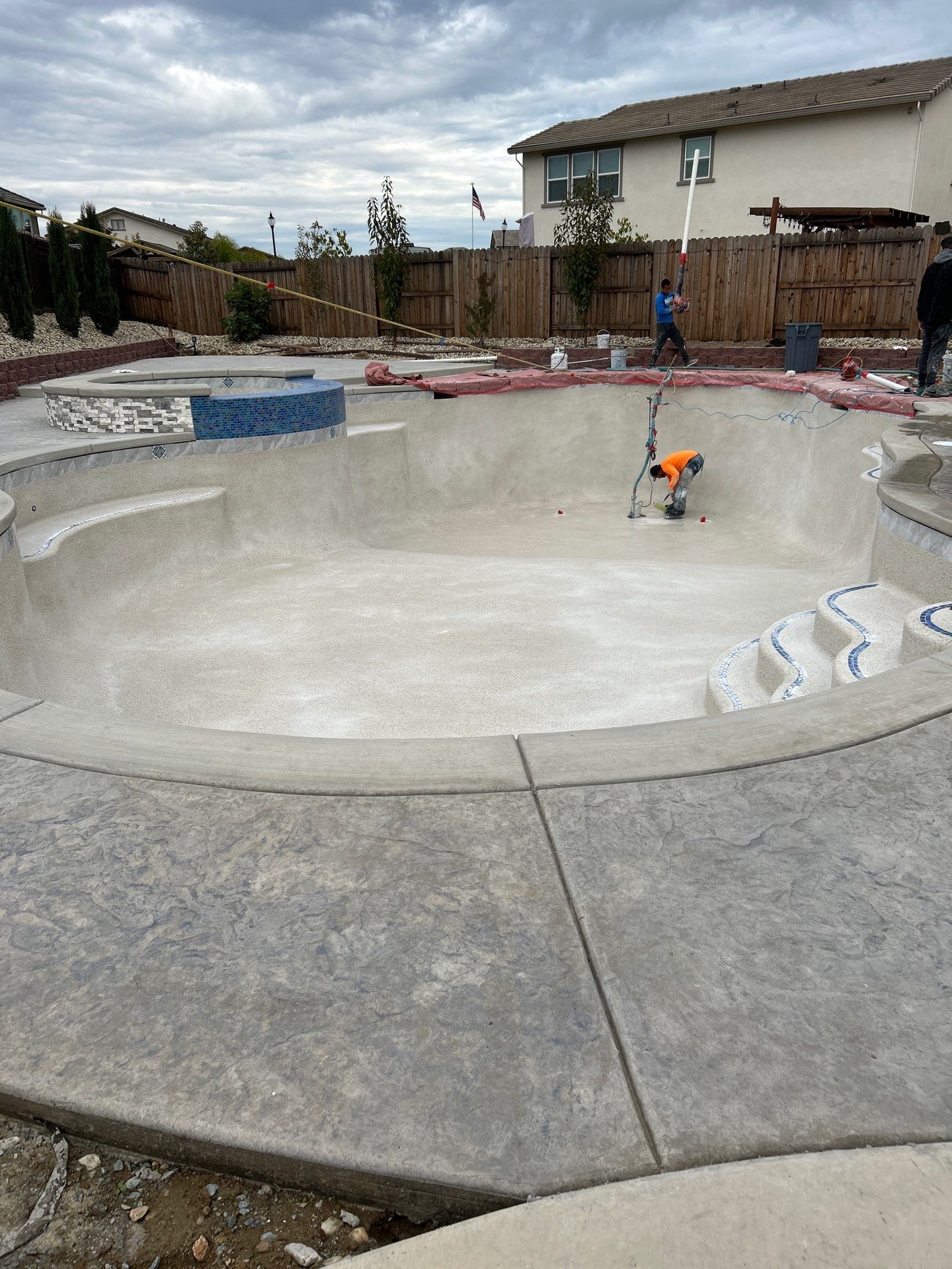 New Pool and Spa with Iridescent Blue Tile in Roseville by Dolphin Pools and Spas