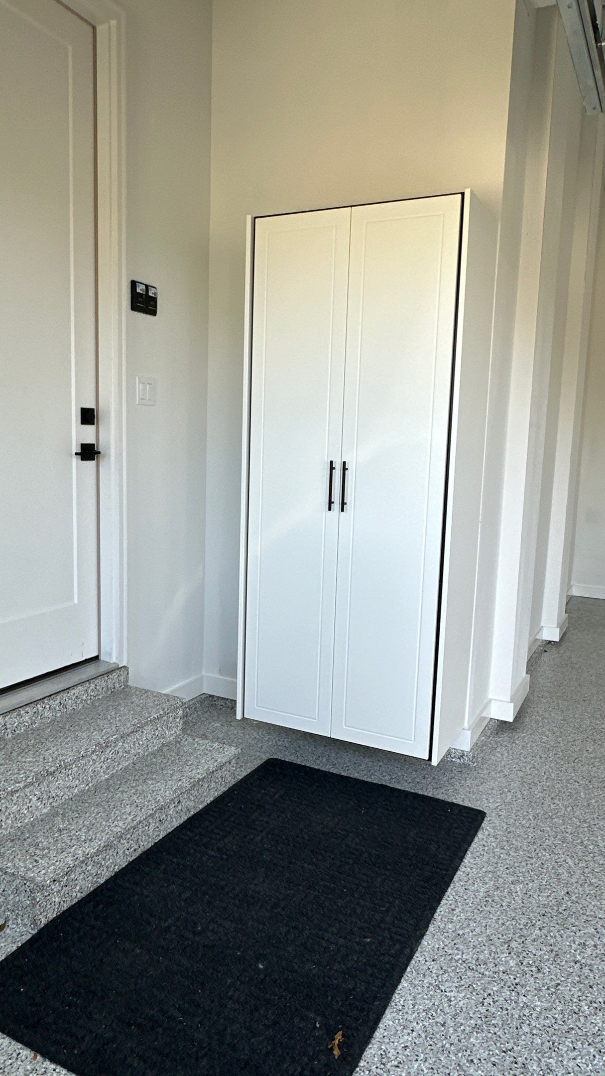 Jon S. transformed his garage with a new floor, slotwall & Cabinets!  by Banner Garage