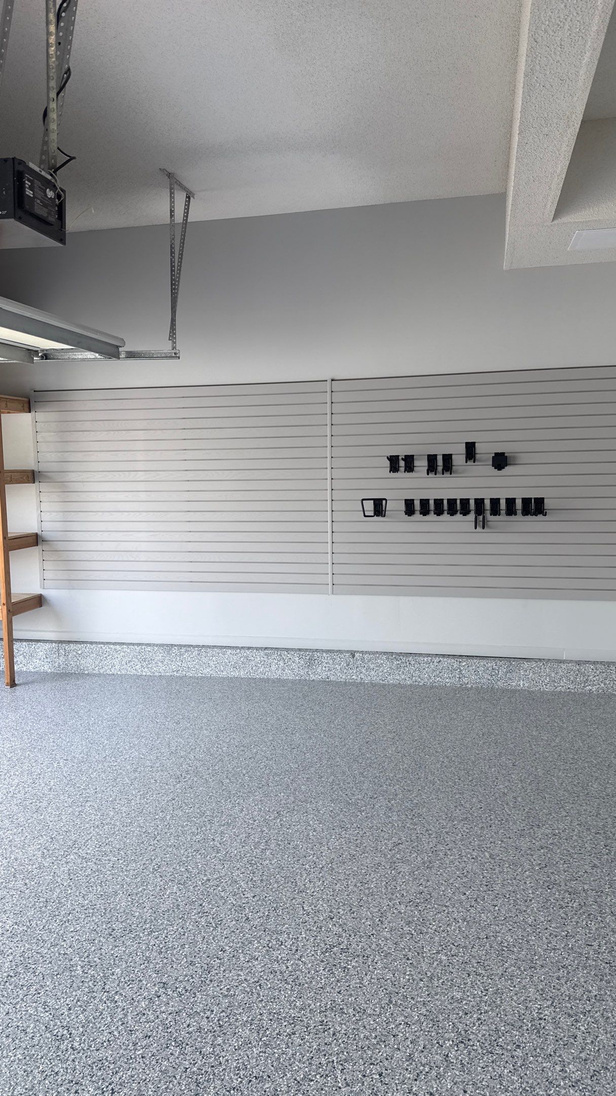 Comprehensive Garage Renovation Featuring Epoxy Flooring and Custom Storage in Shawnee by Banner Garage