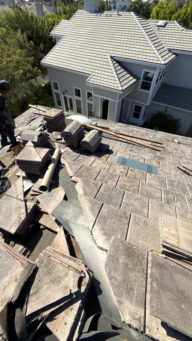 Carlsbad Concrete Tile Roof Replacement with Copper Flashing and Skylights by Reliable Roofing San Diego Inc.