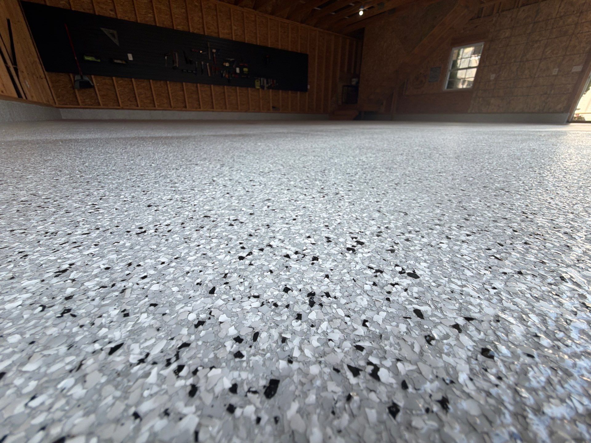 Custom Epoxy Flake Garage Floor Installation in Norton Shores by Gordon Painting