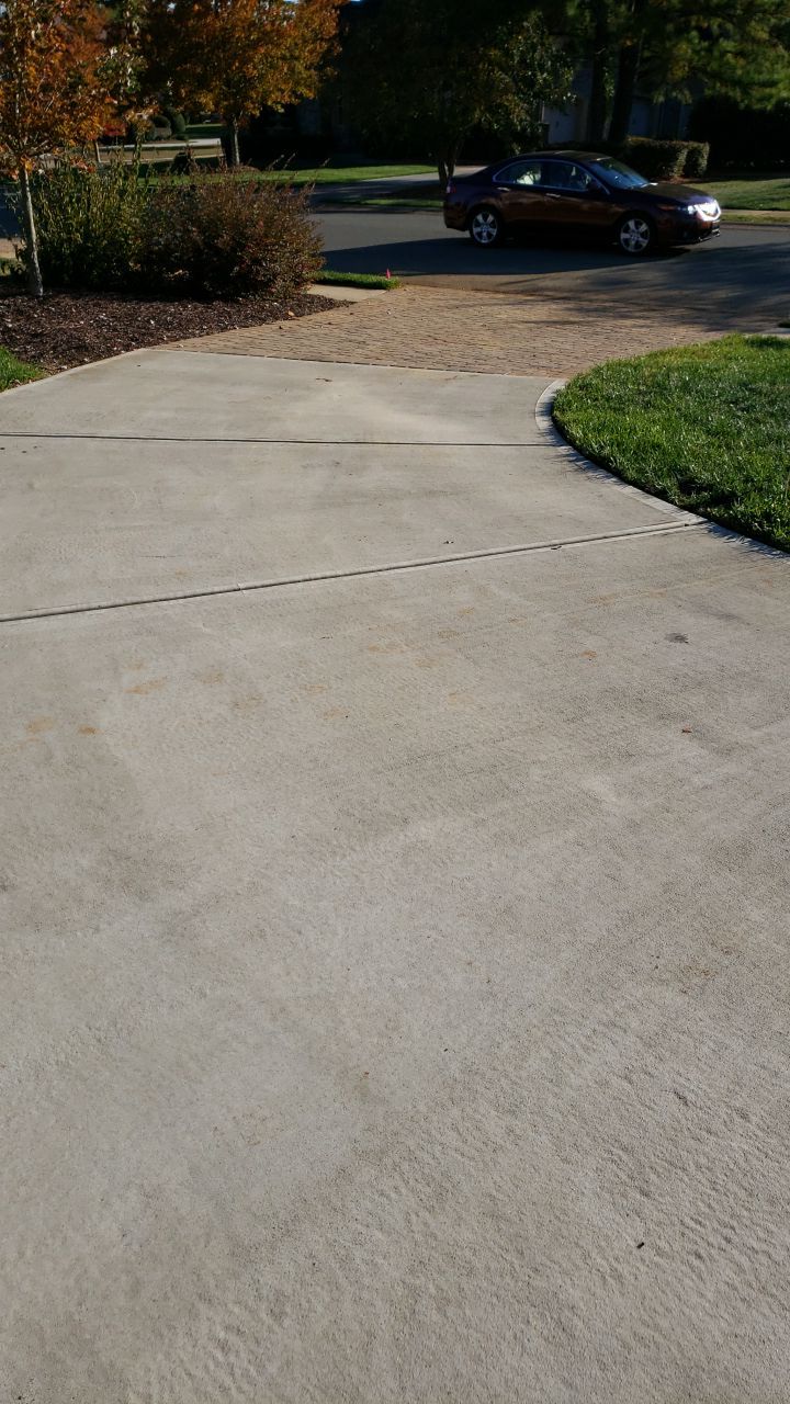 Driveway Clean using cleaner by Power Wash Masters LLC
