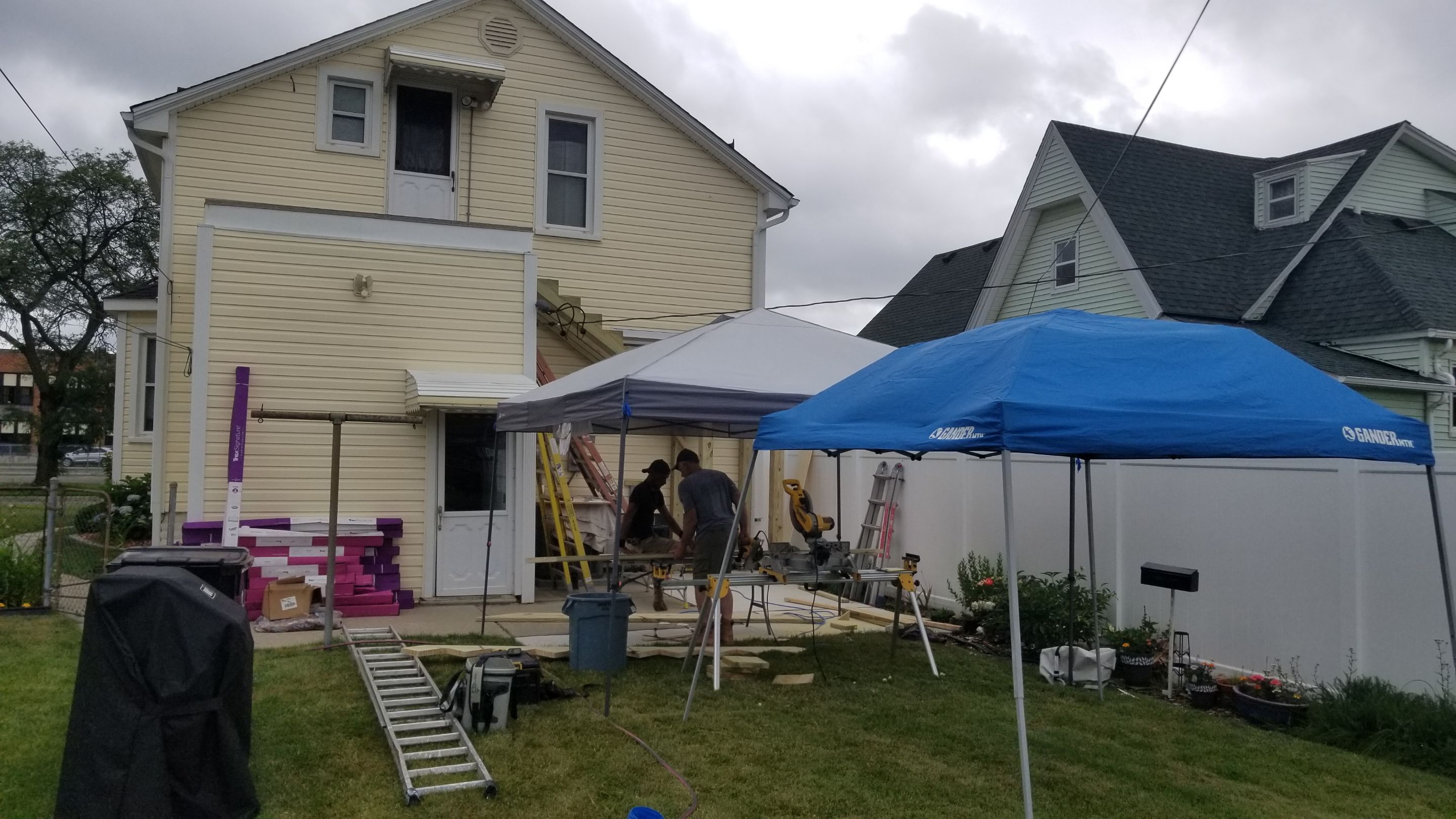 Rebuild balcony flat roofing TREX decking stairway and Railings in Wyandotte, MI by Northwest Construction 