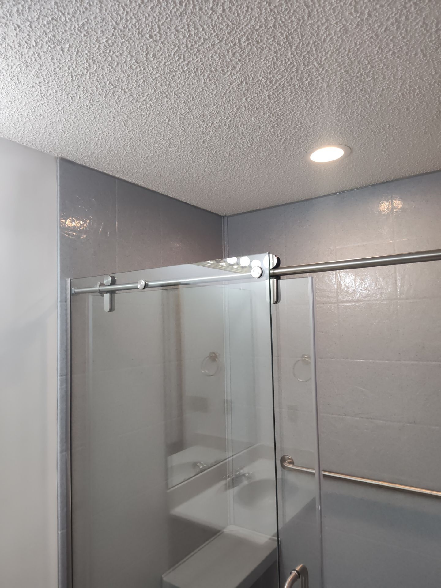 Bathroom Remodel using Onyx base and shower walls with seat & caddie by Cornerstone Home Builders, LLC