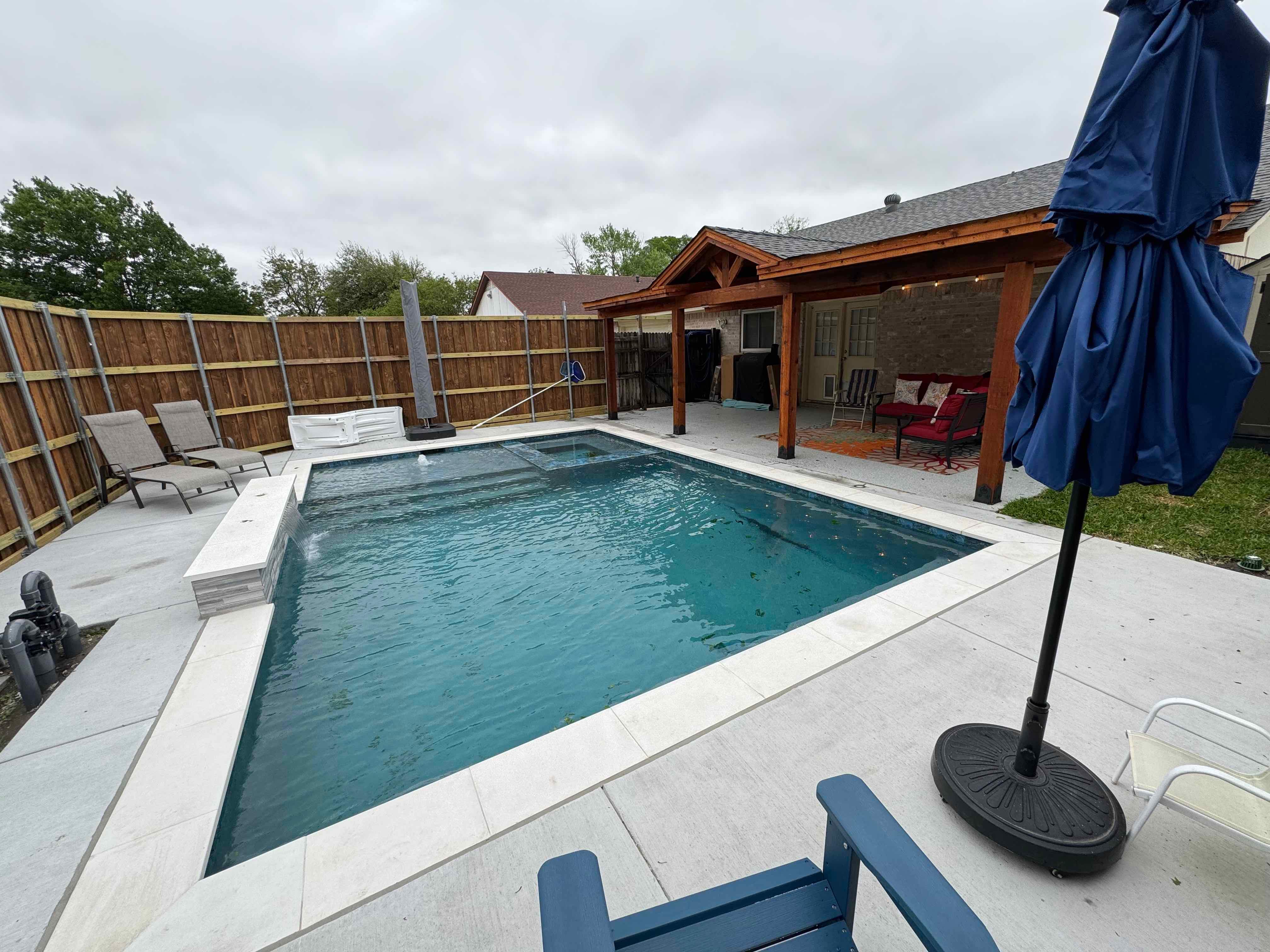 Geometric Pool with Raised Spa and Tanning Ledge by Pinnacle Pools and Spas - DFW