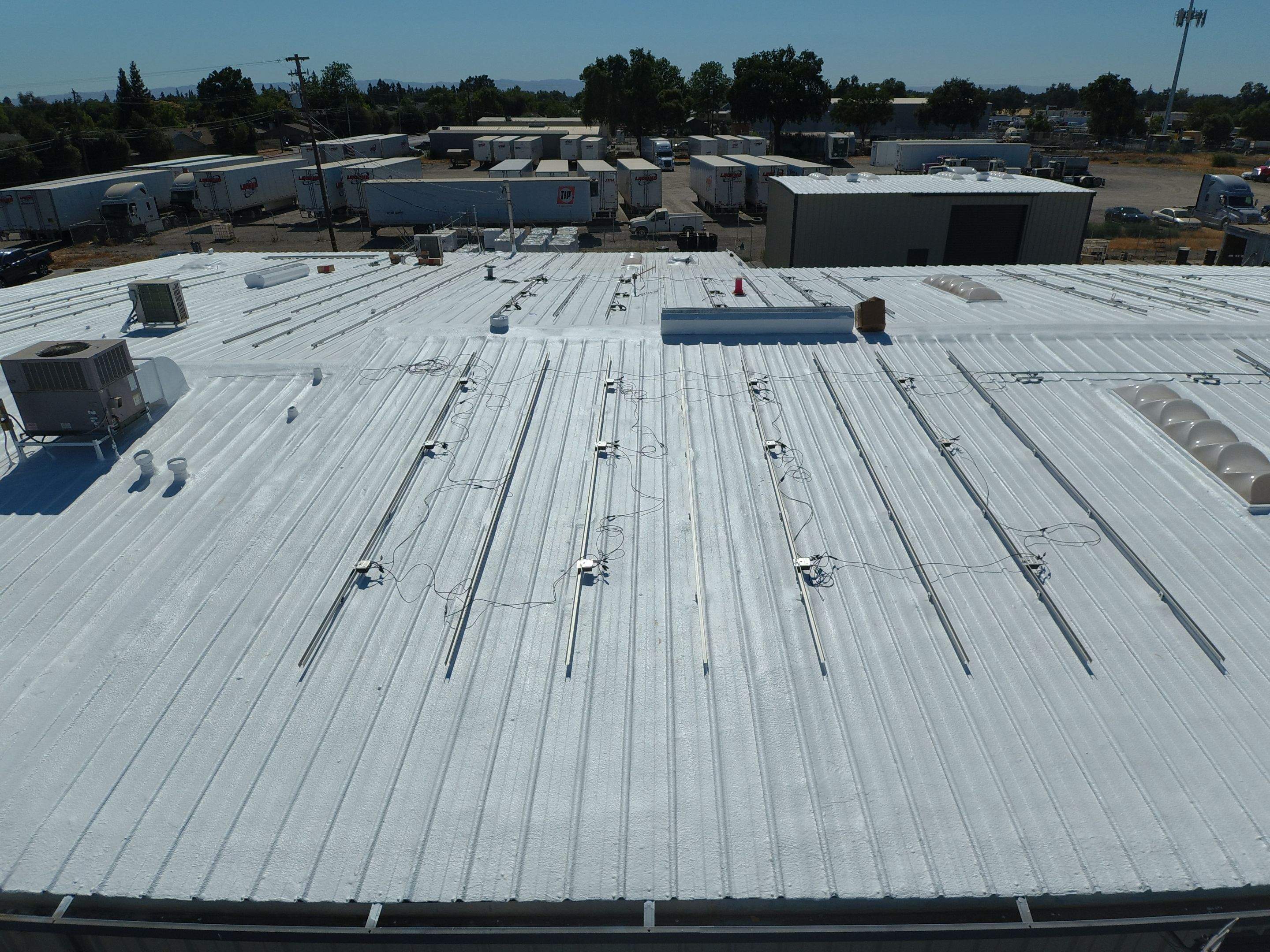 Spray foam and coatings using Conklin Benchmark/PUMA XL coatings and spray foam by Straight Edge Roofing Inc
