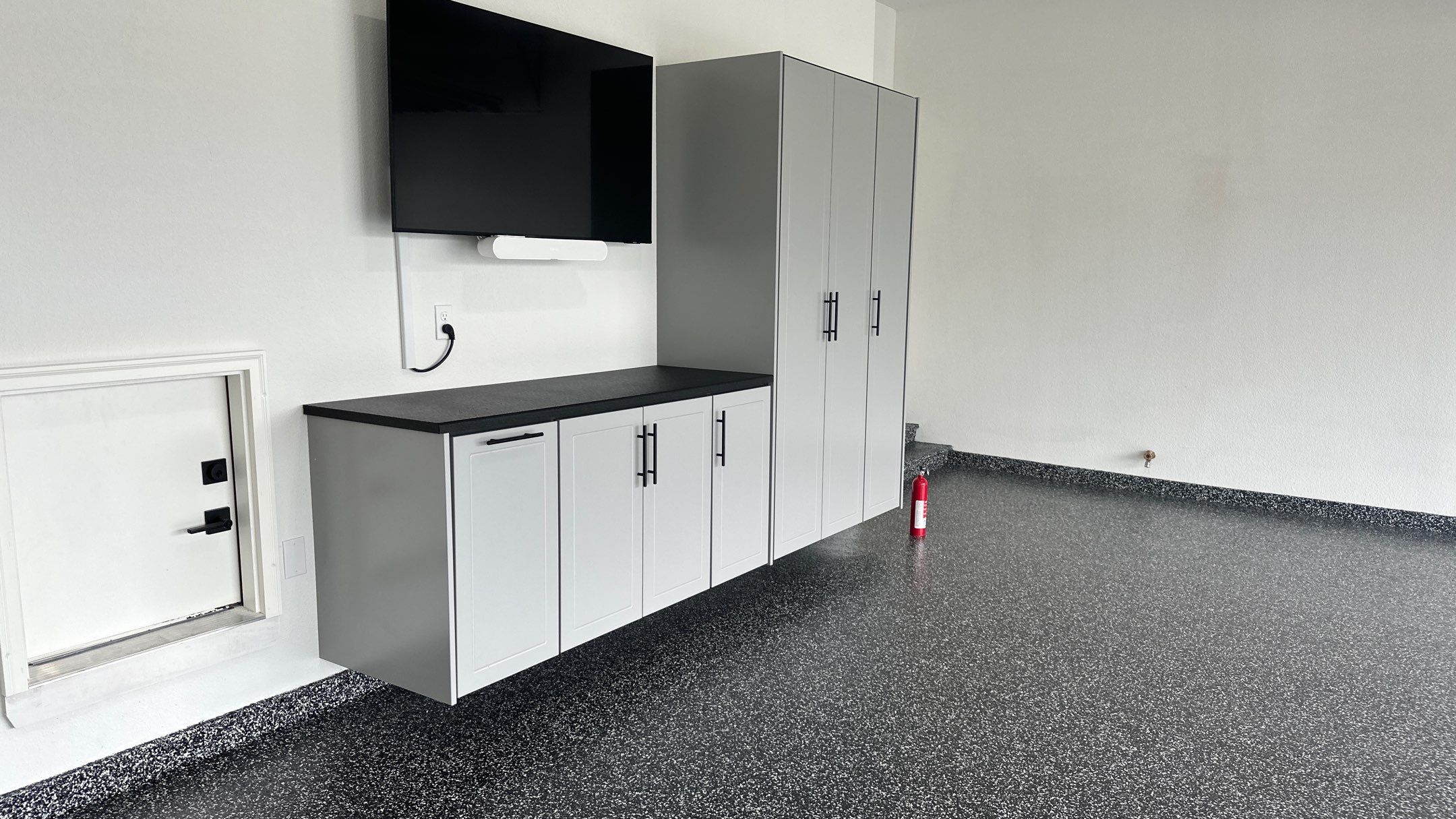 John H. received his dream garage with cabinets and a Banner Garage Floor by Banner Garage