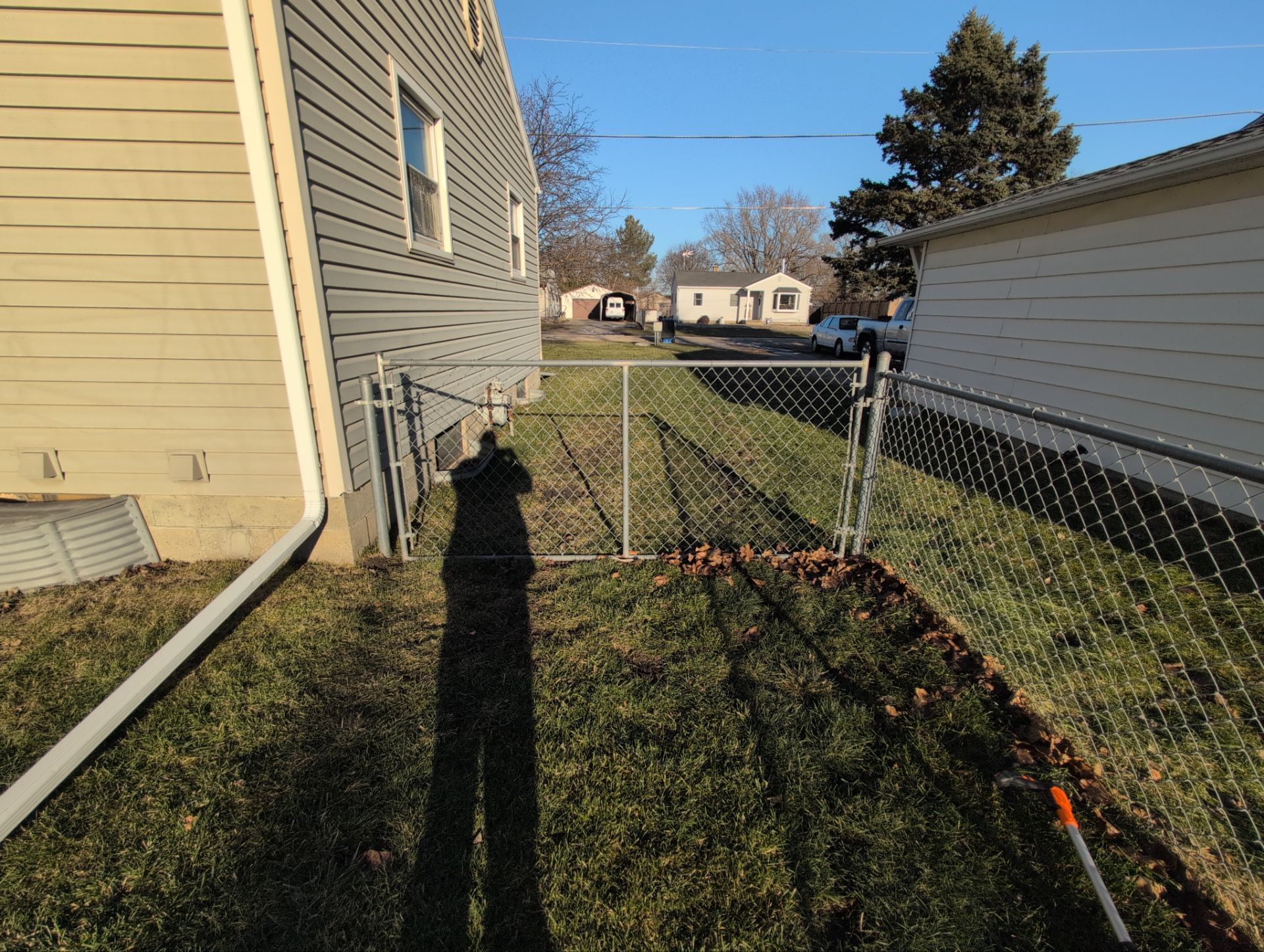 Galvanized Chain Link Fence and Vinyl Gate Installation in Washburn by Perfect Picket Fence and Stain