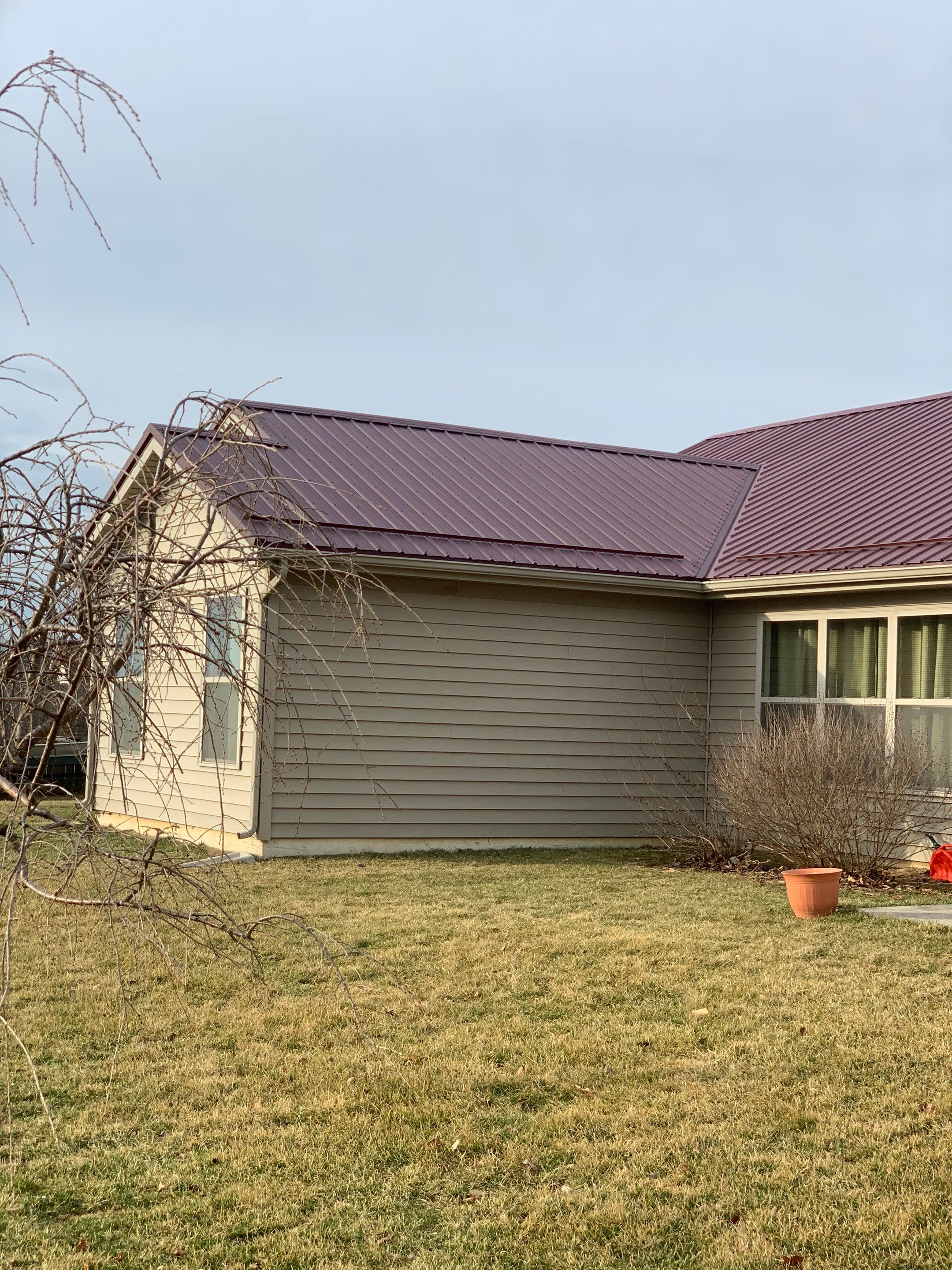 Burgundy Exposed Fastener Metal Roof in Columbia City, Indiana Country Home by 4Ever Metal Roofing