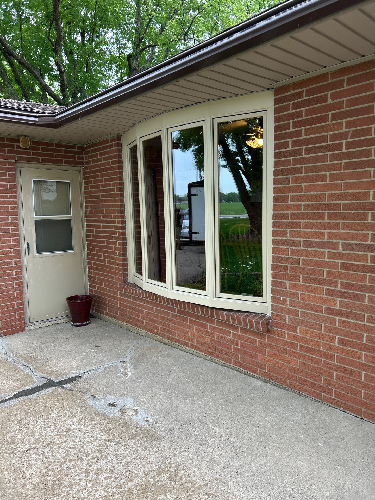 Bow window replacment using Pella Lifestyle wood/Aluminum window by United Windows and Siding LLC