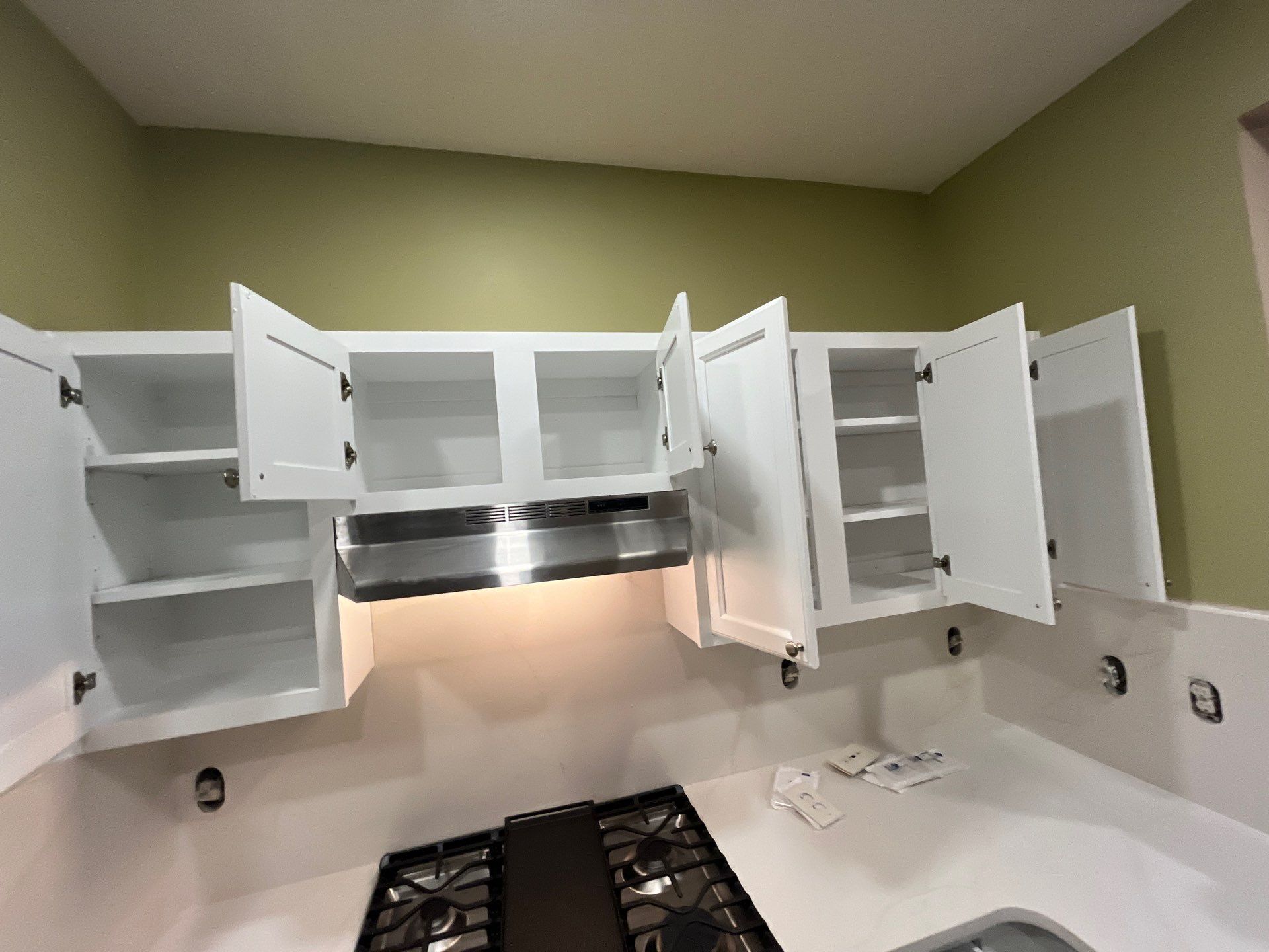 Cabinet Painting - wood to white by Five Star Painting