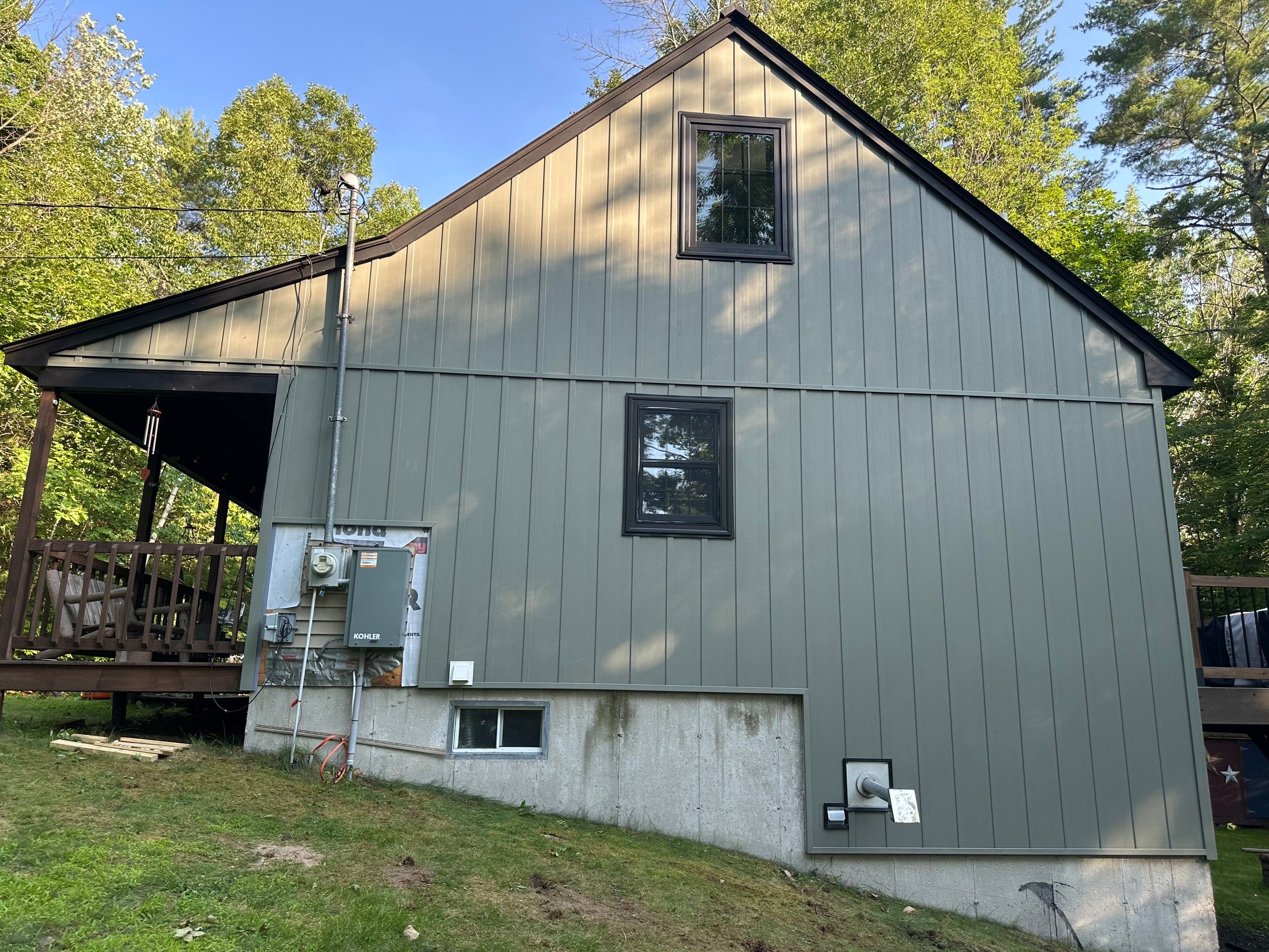Sage Green Board and Batten Siding and Deck Upgrade in Standish by Tall pine roofing