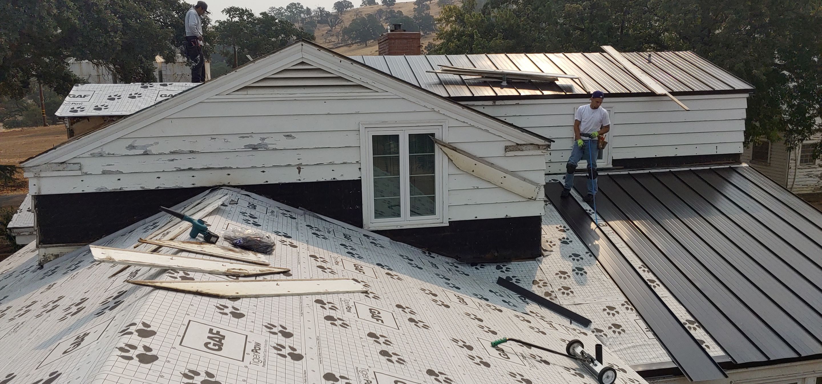 Residential Roofing Installation using Standing seam metal roofing system by Straight Edge Roofing Inc