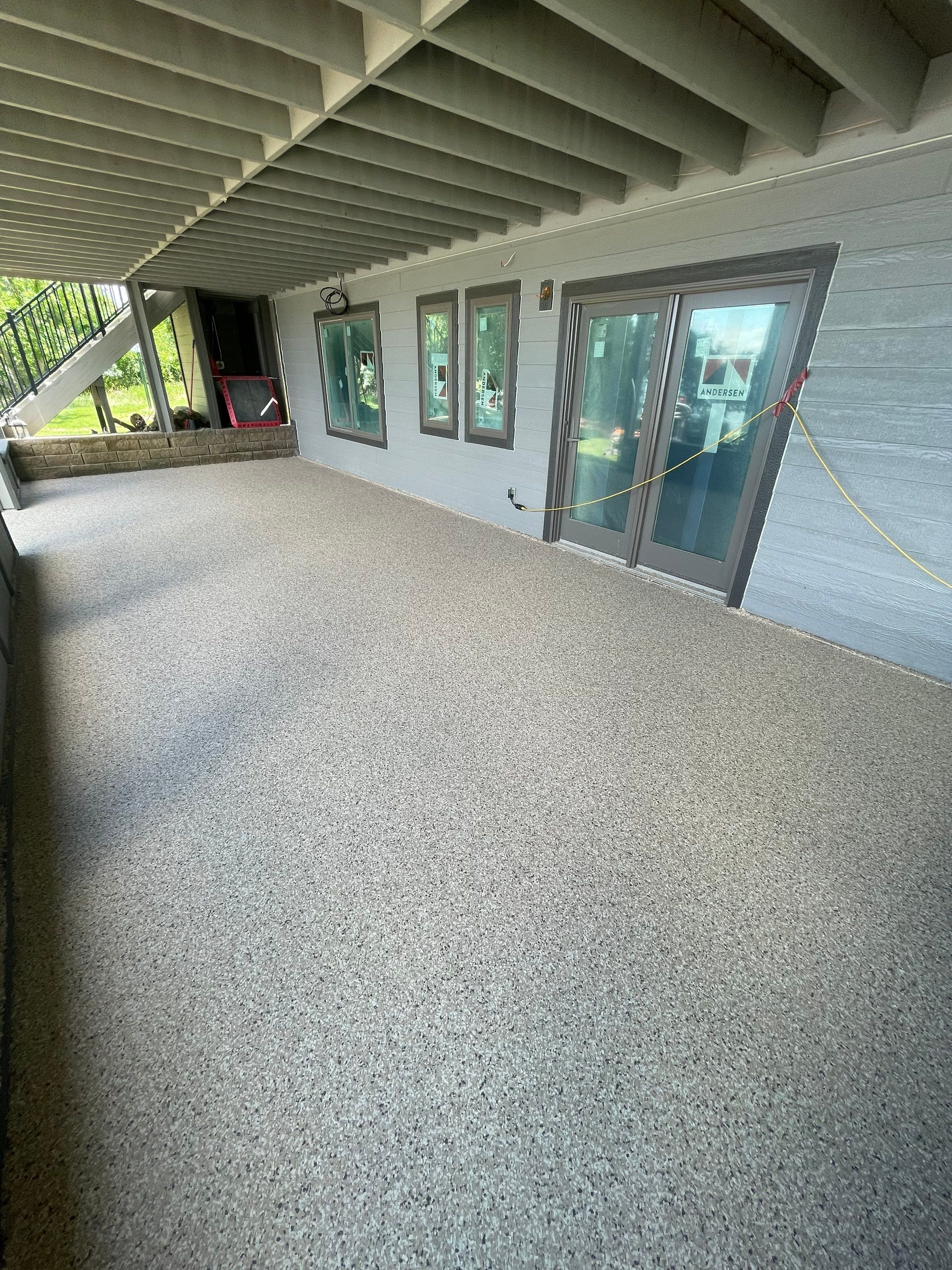 Lakefront Screened Patio Concrete Coating Installation in Wentworth by Select Painting, Coatings & Garage Cabinets